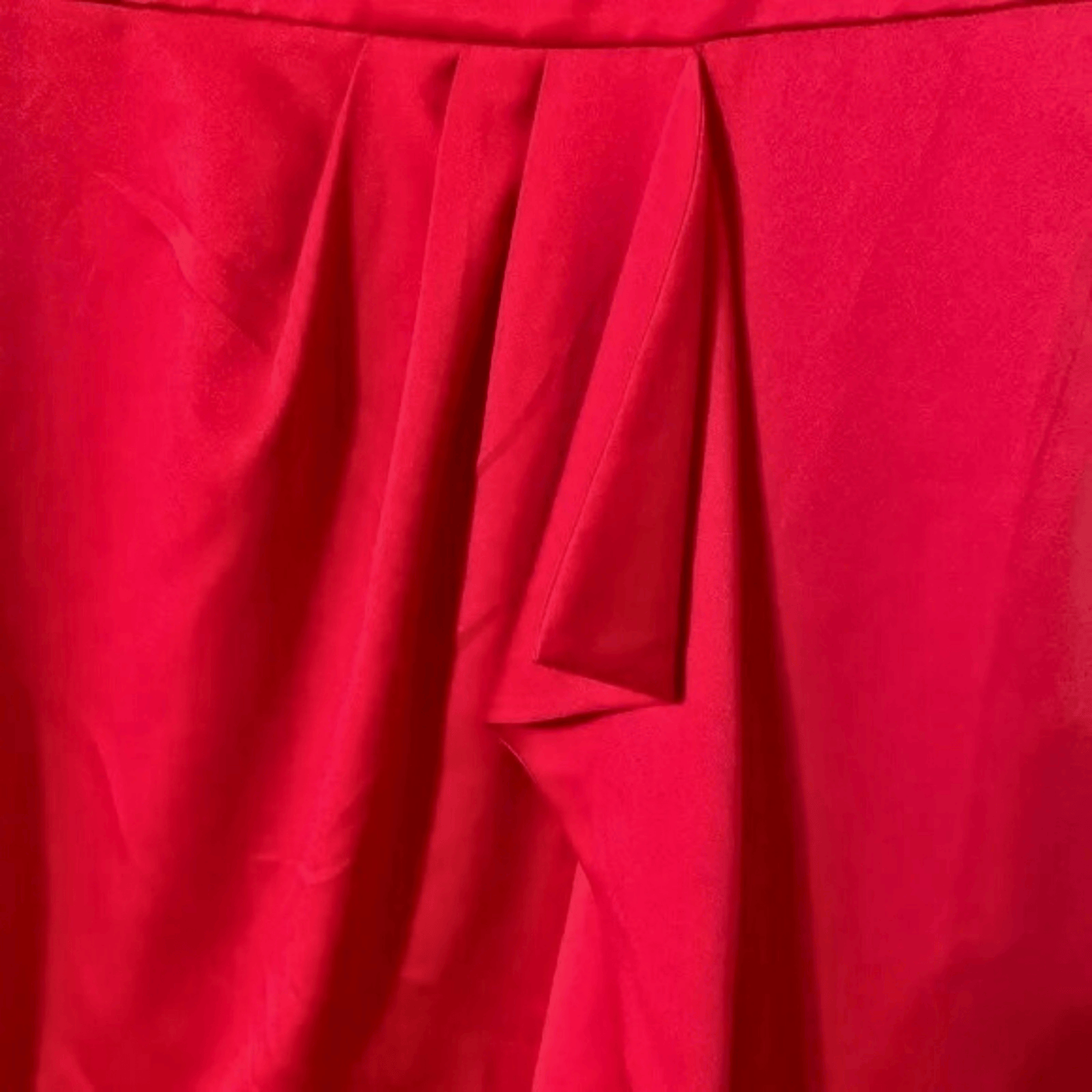 Close-up of red fabric with pleated texture