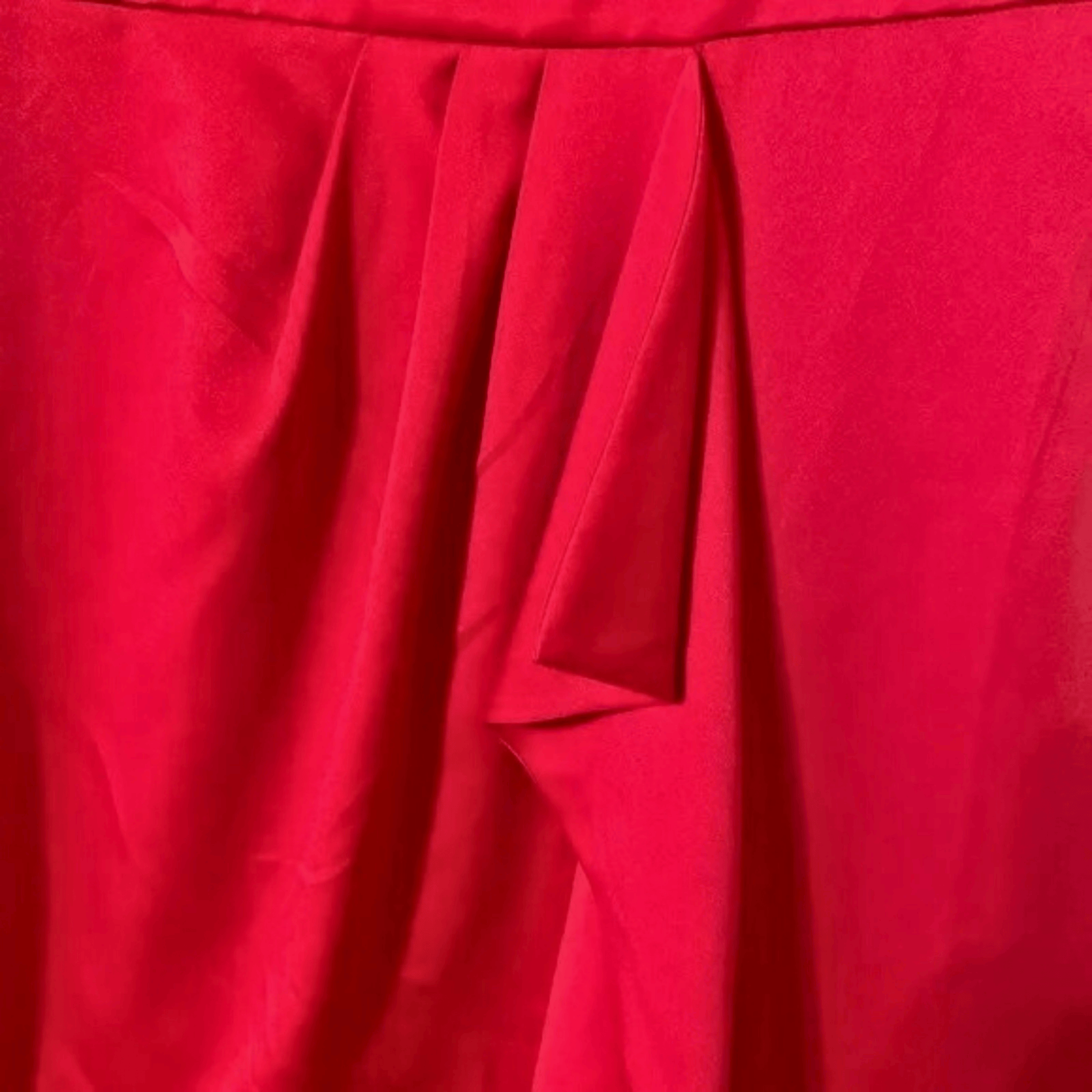 Close-up of red fabric with pleated texture