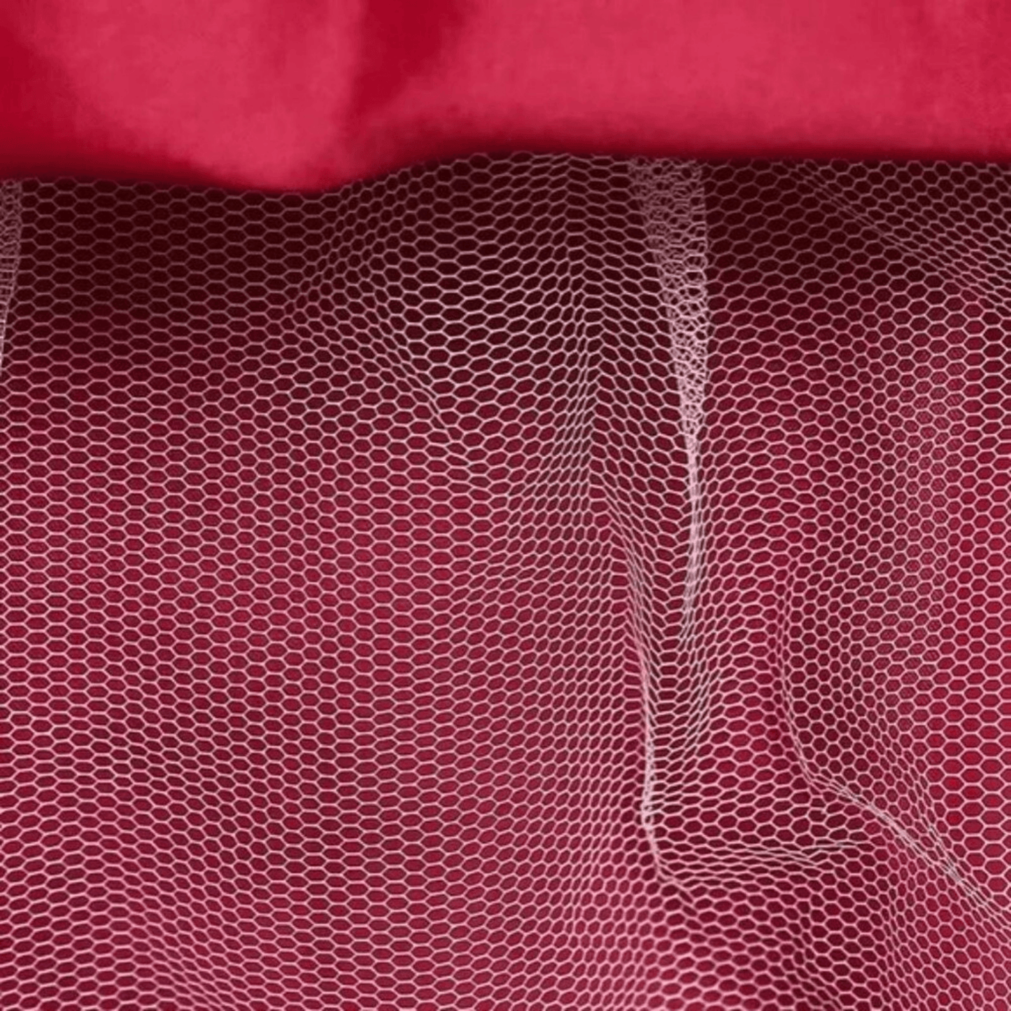 Close-up of red fabric with a textured pattern