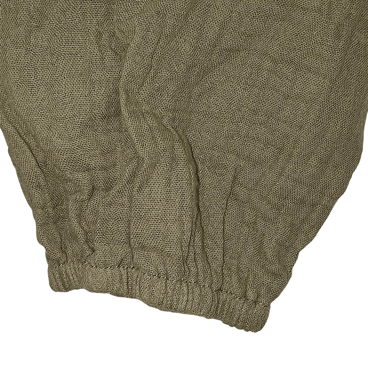 Close-up of a textured brown fabric with a brand name on a transparent background