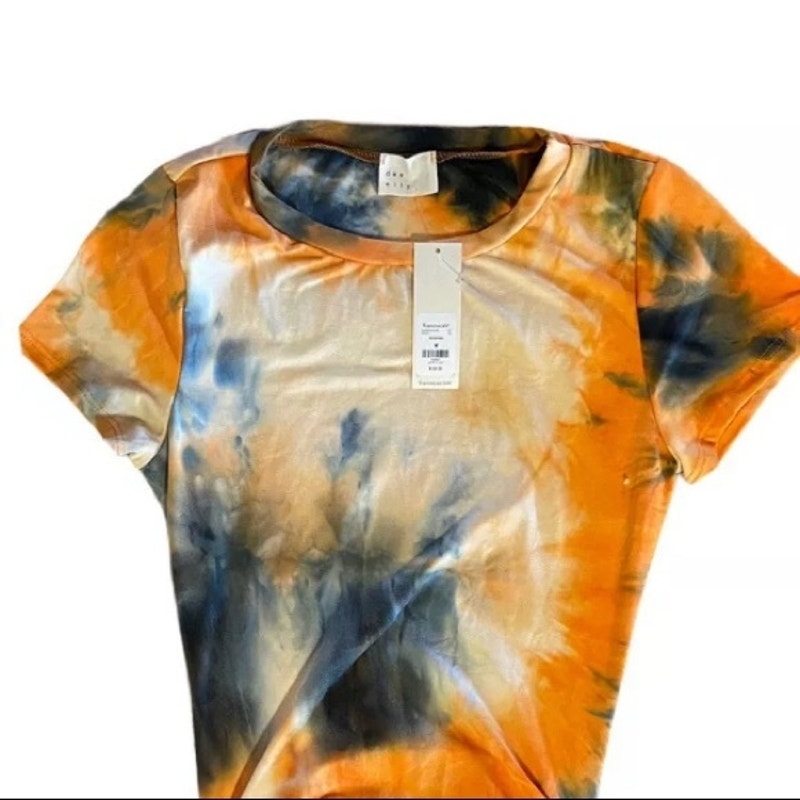 Tie-dye t-shirt with orange, blue, and white colors on a white background