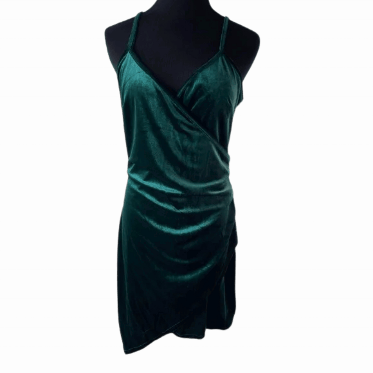Green velvet dress on a mannequin against a teal background