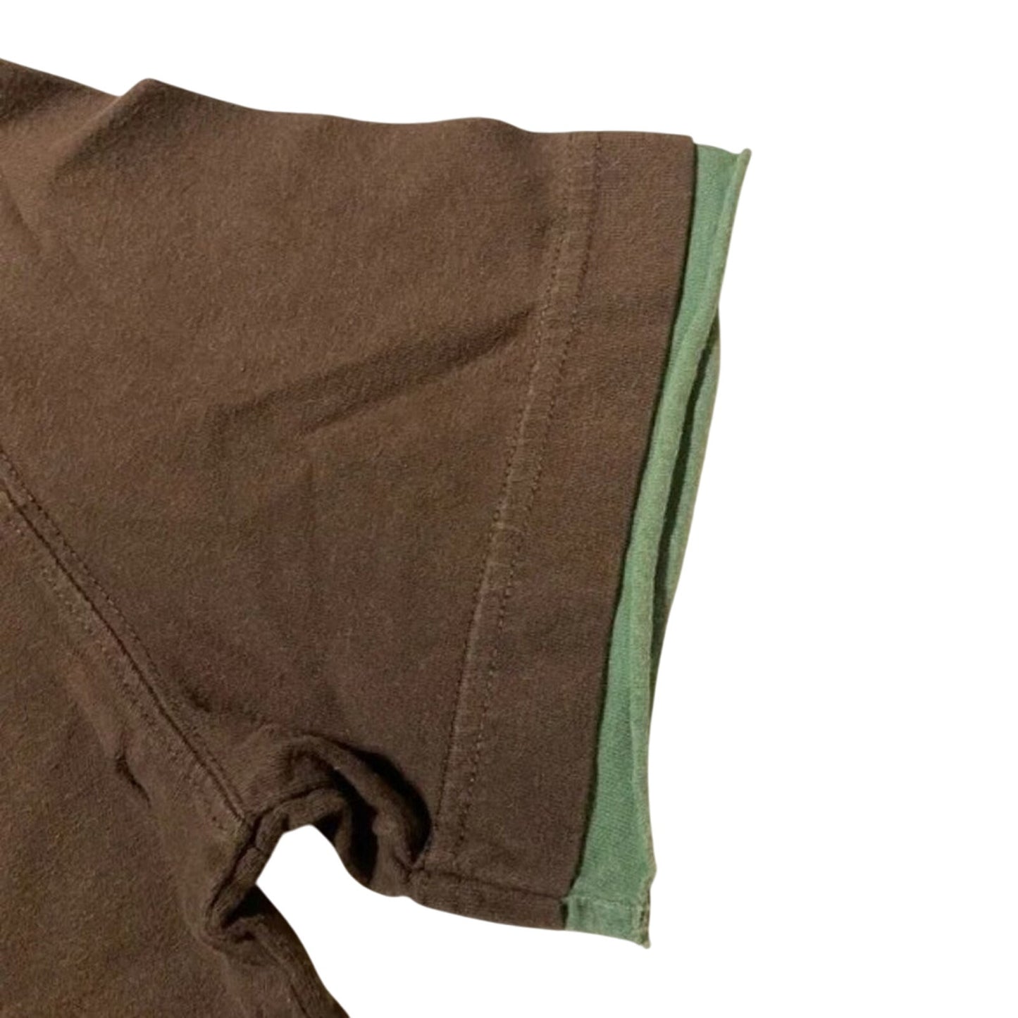 Close-up of brown fabric with green lining on a white background