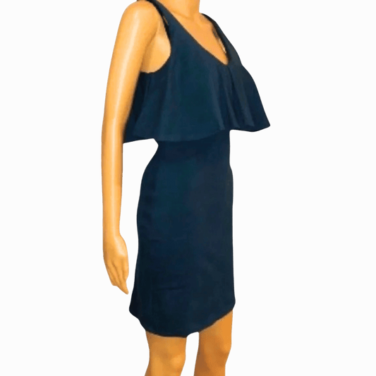 Navy blue dress on a mannequin against a gray background