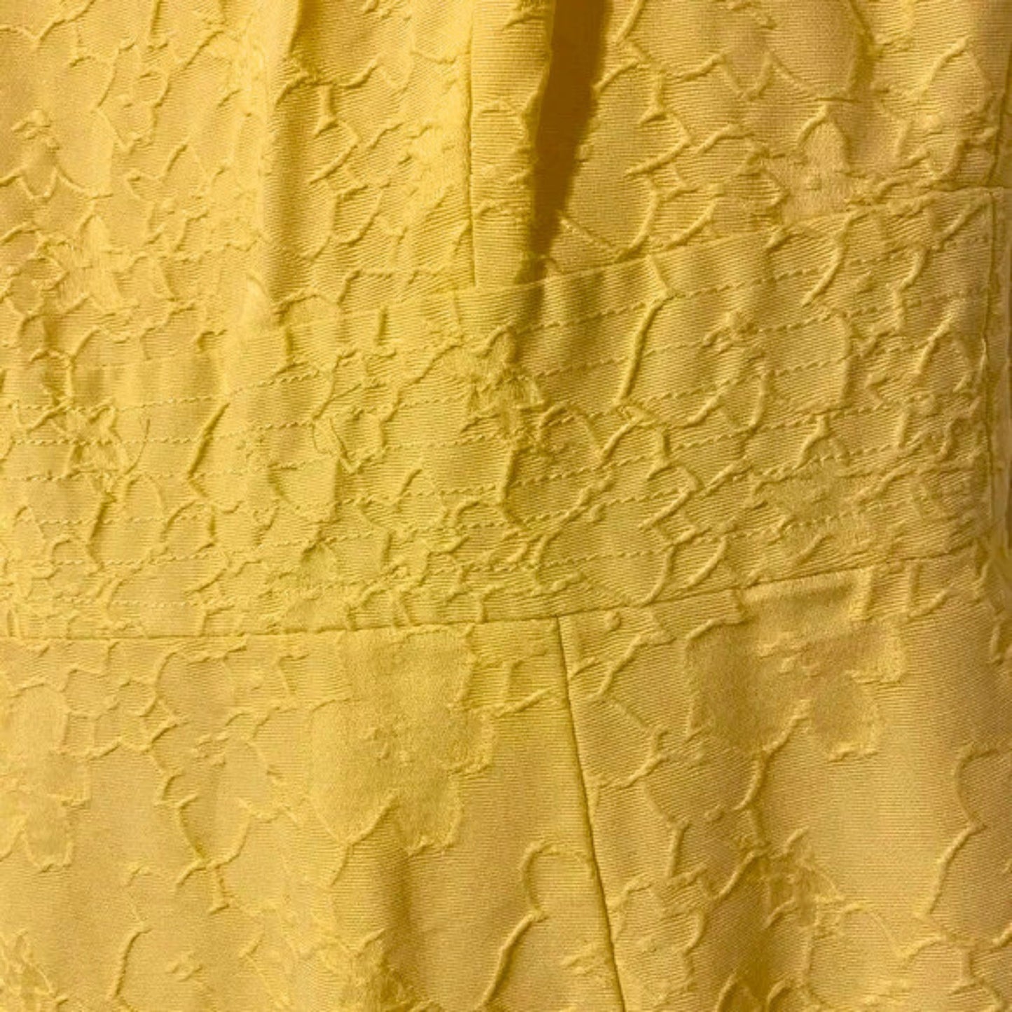 Close-up of textured yellow fabric