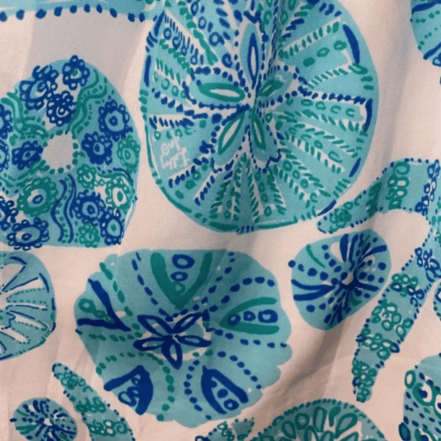 Close-up of fabric with blue and green floral pattern