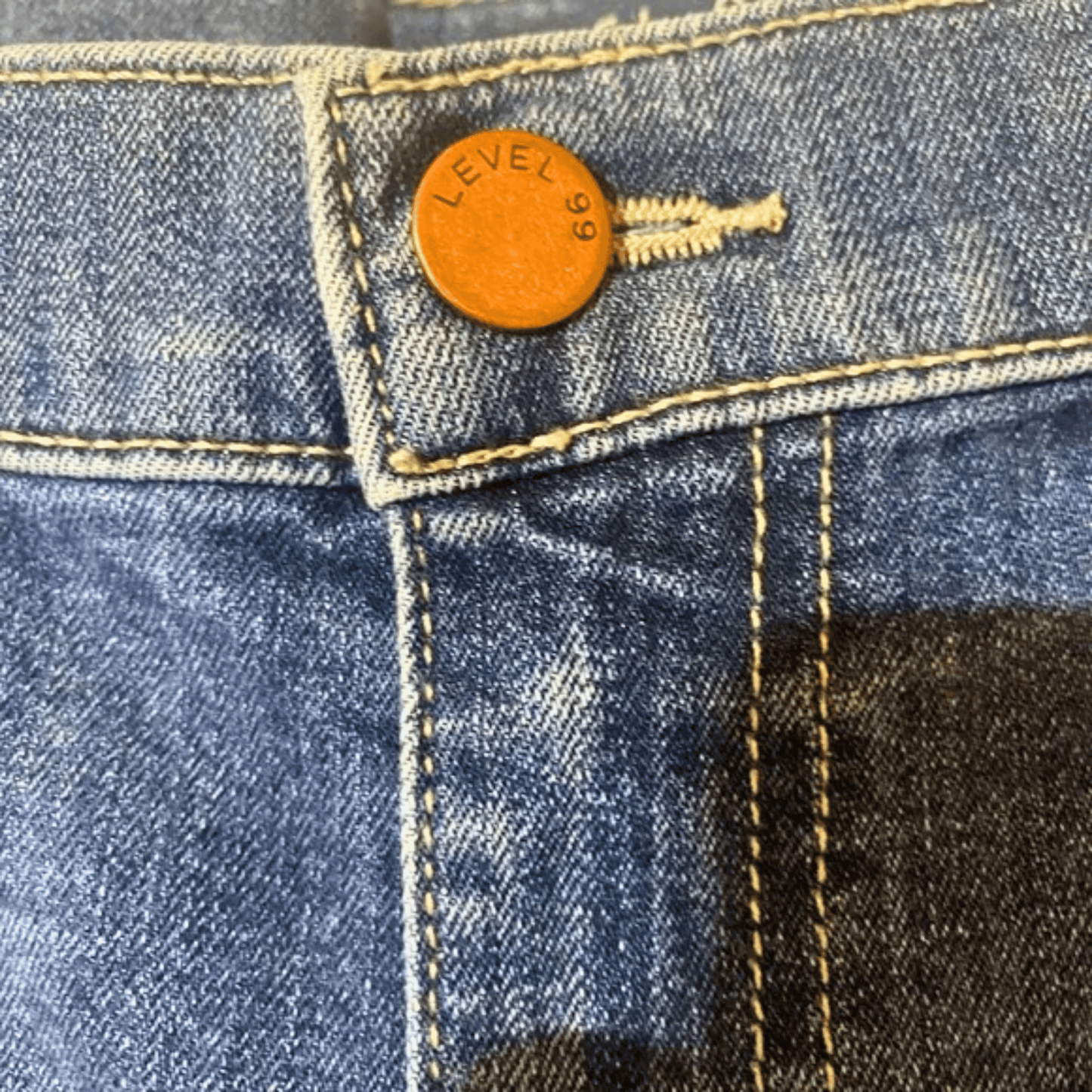 Close-up of a Levi's button on a denim fabric