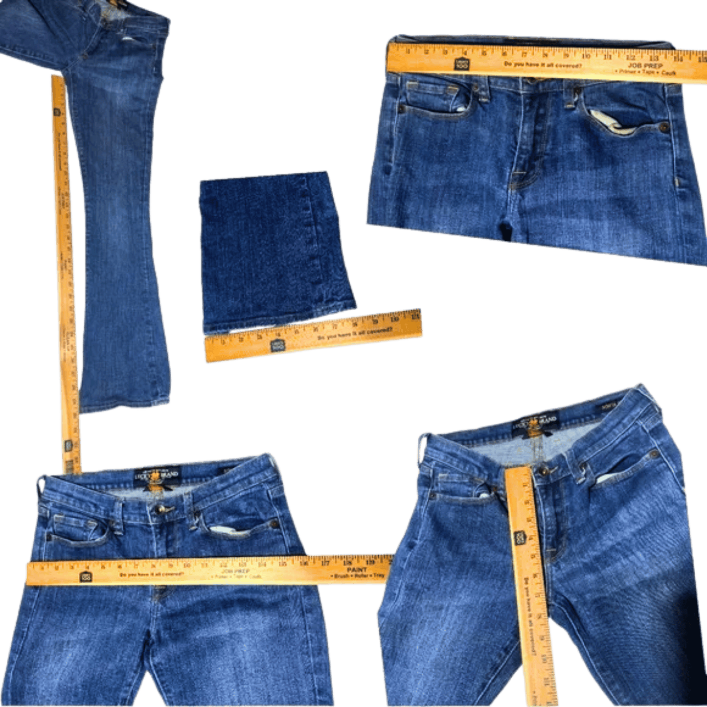 Blue jeans with measuring tapes showing different measurements on a white background