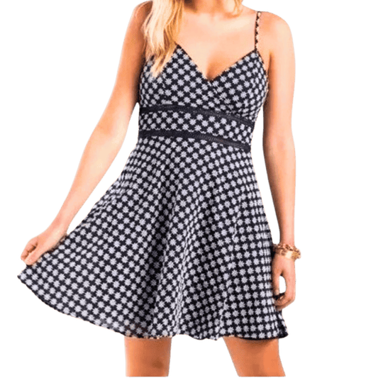Woman wearing a black and white checkered dress on a white background