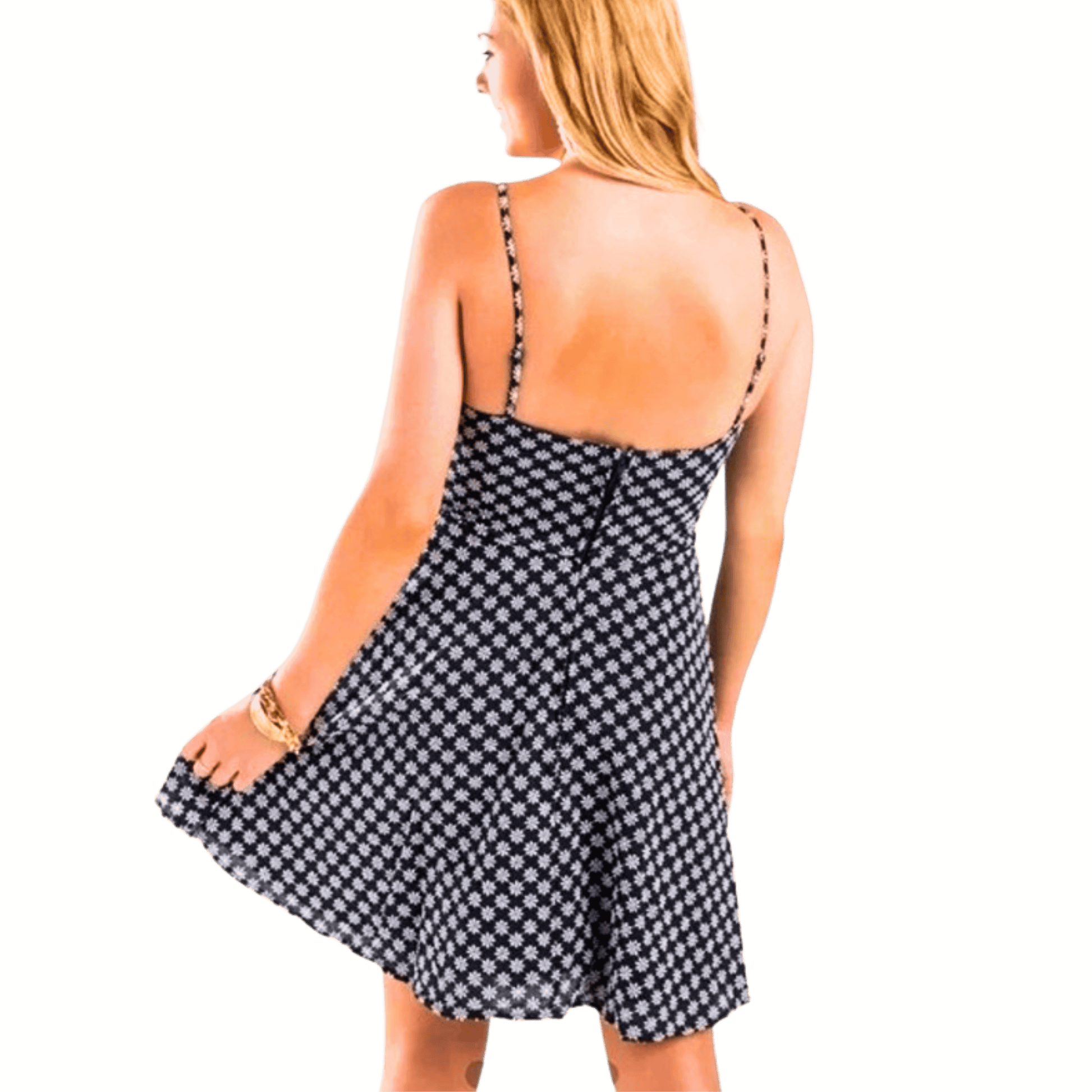 Woman wearing a black and white patterned dress against a yellow background