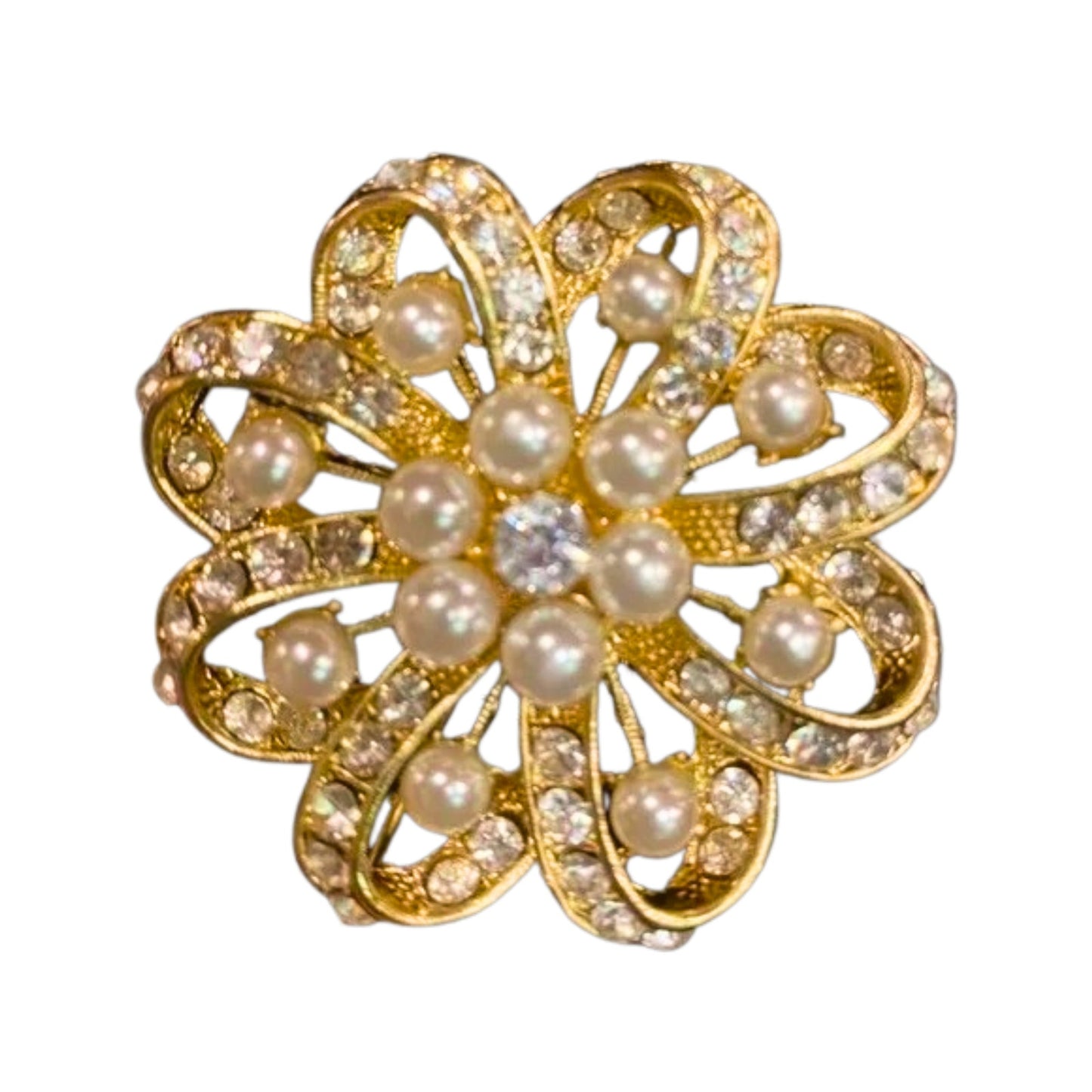 Gold brooch with pearls and crystals on a white background