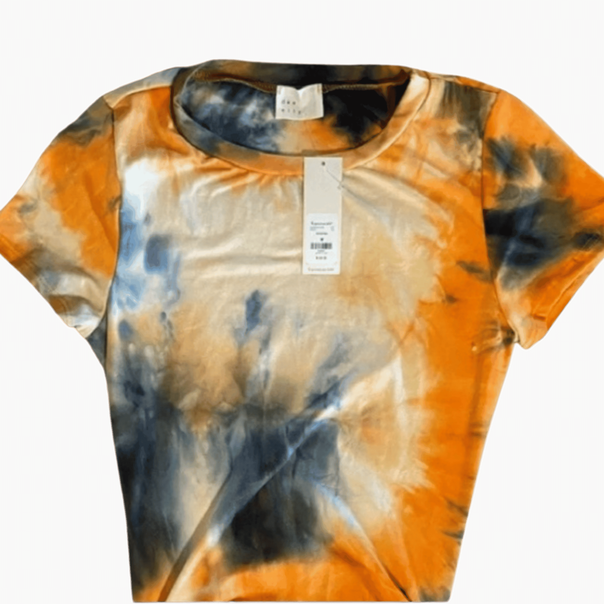 Tie-dye t-shirt with orange, black, and white pattern on a brown background