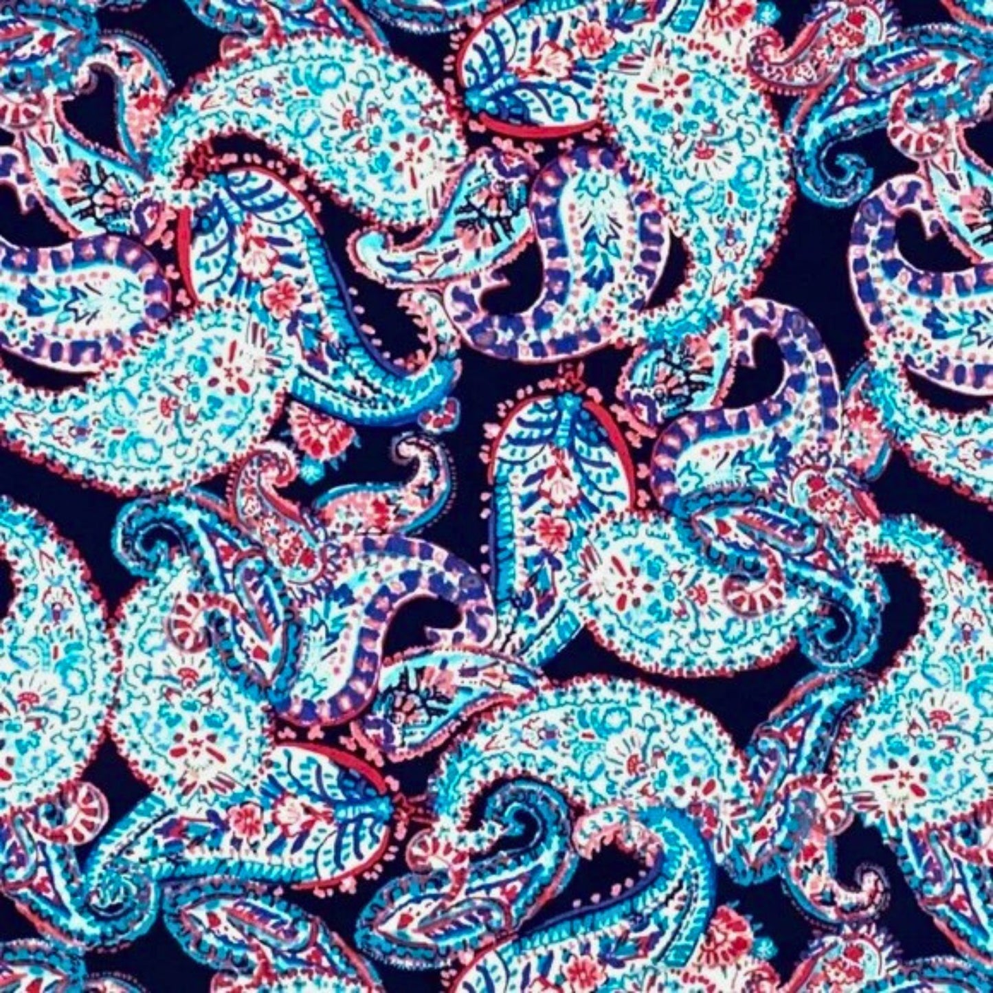 Pattern of colorful paisleys on a dark blue background