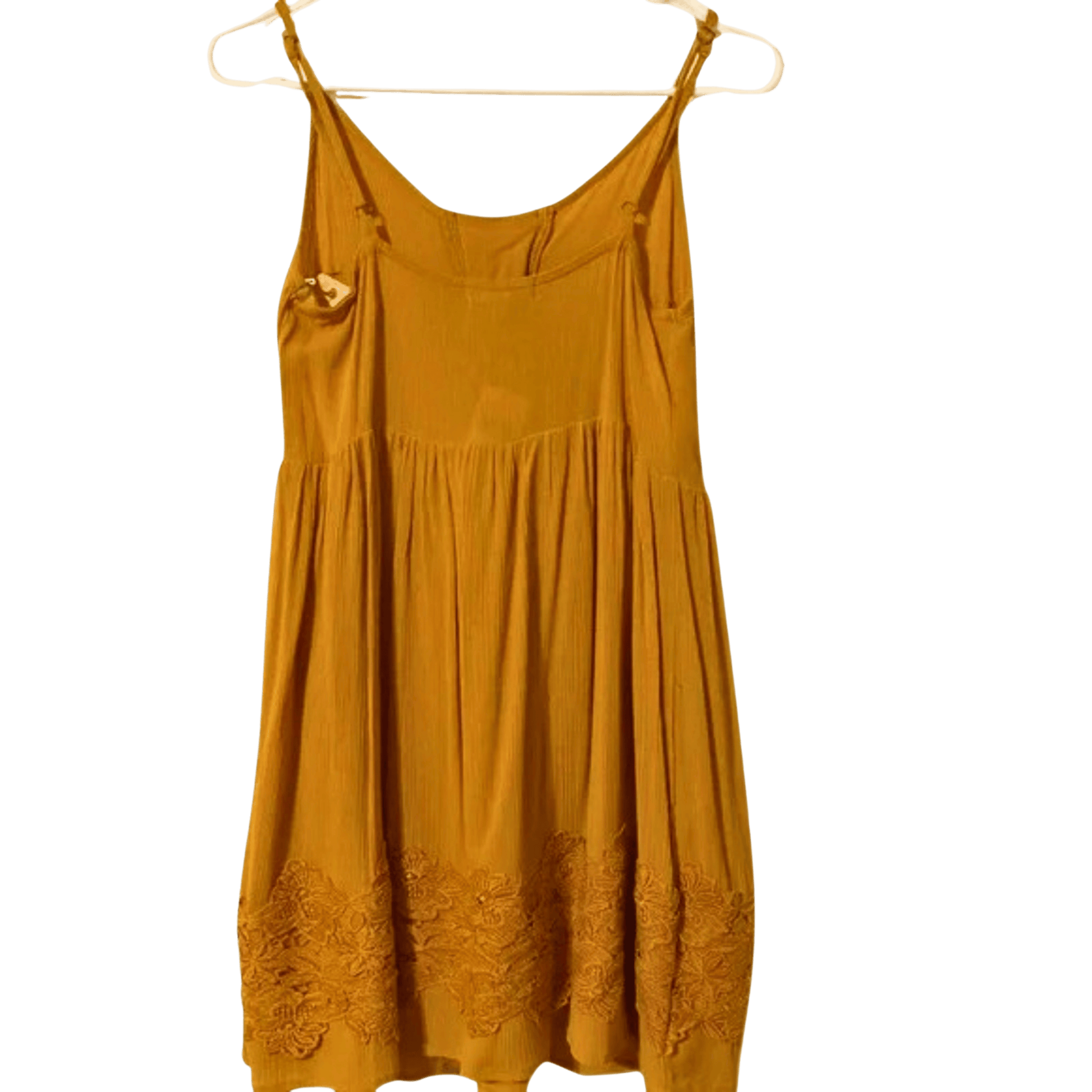 Yellow dress with floral details on a white hanger against a green background