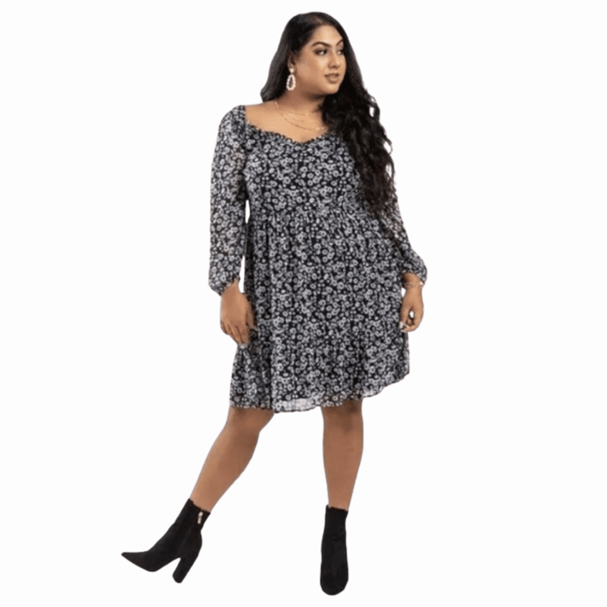 Woman wearing a black floral dress on a black background
