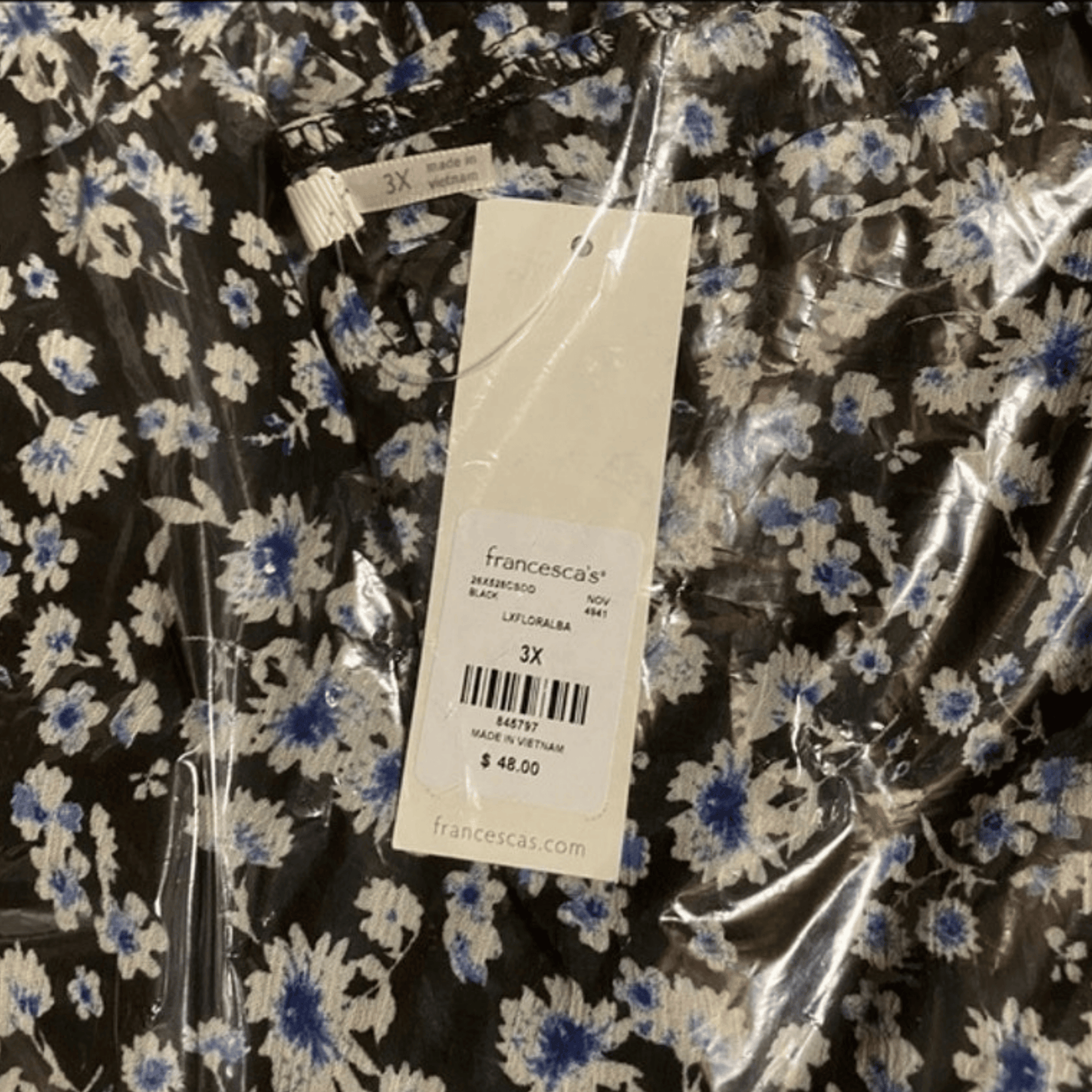 Floral dress with a Francesca's tag on a clear plastic bag
