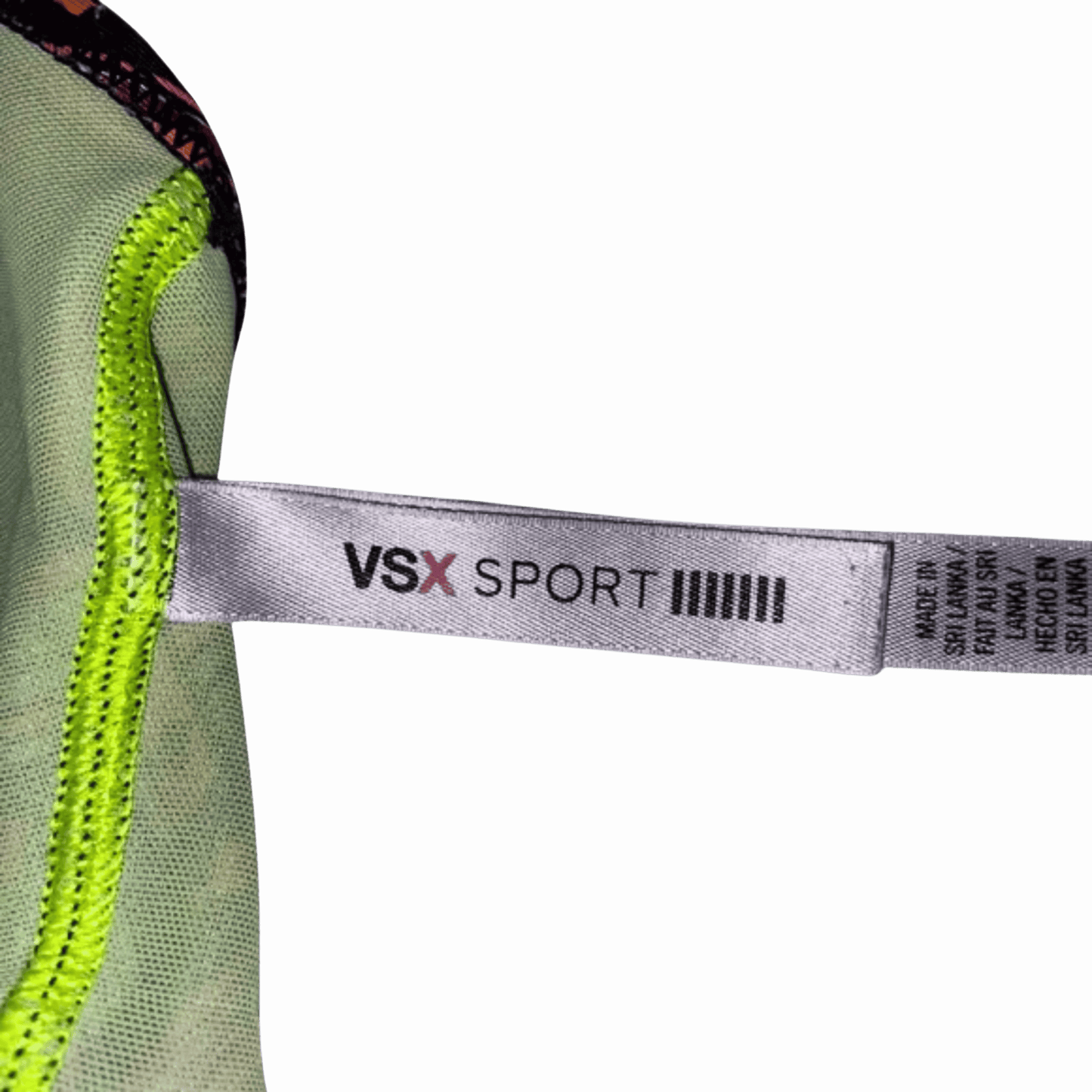 Close-up of a VSX Sport label on a green fabric background