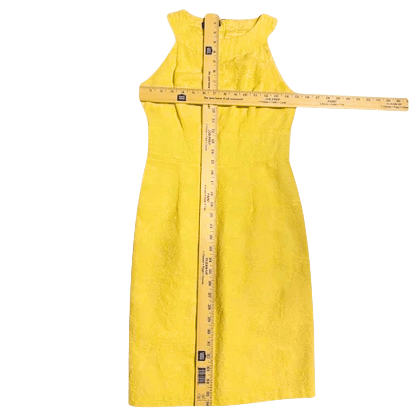 Yellow dress with a measuring tape on a transparent background