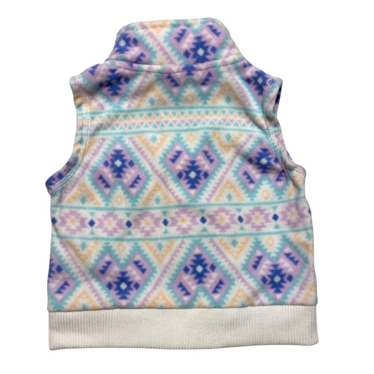 Pastel patterned vest on a white background