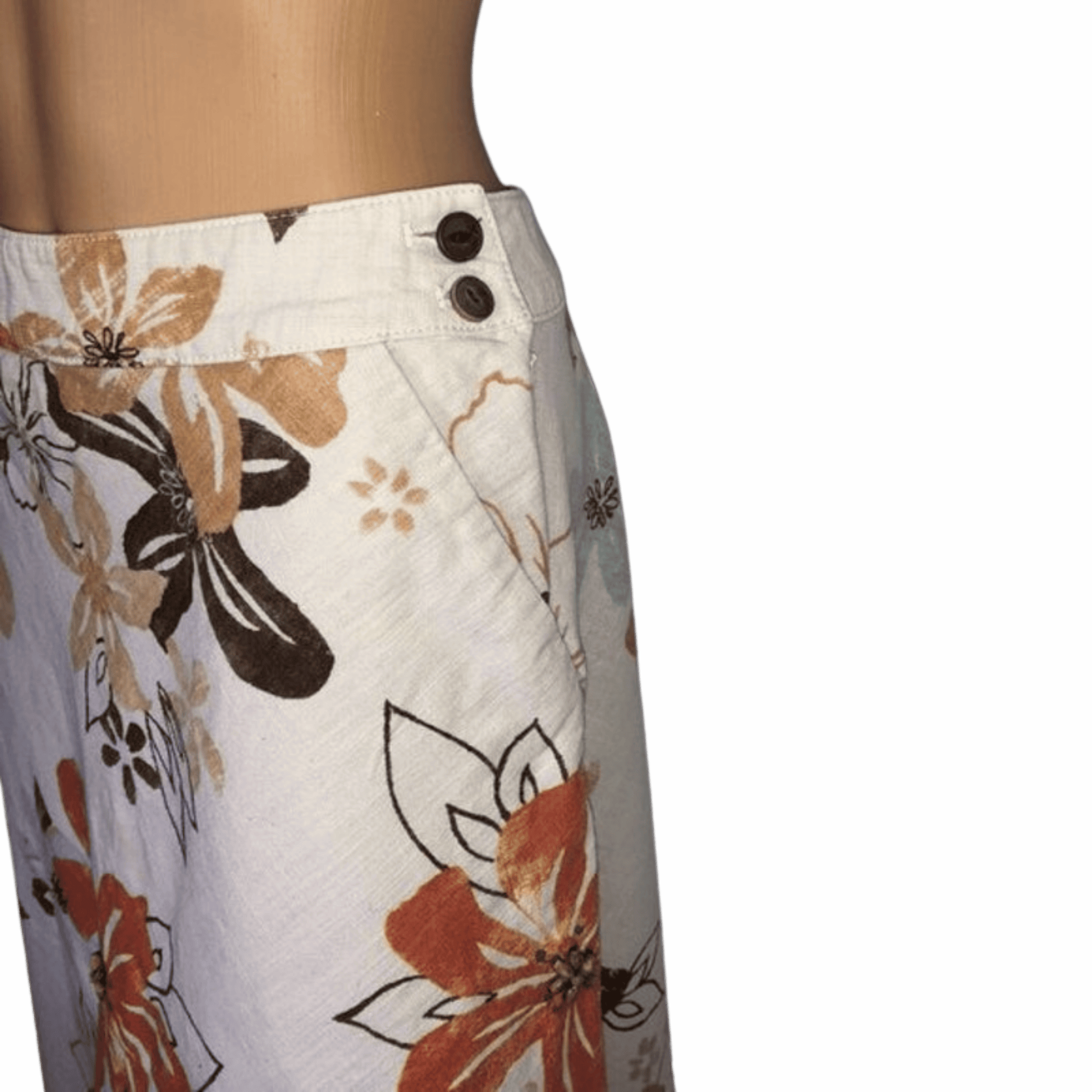 Floral-patterned pants with buttons on a black background