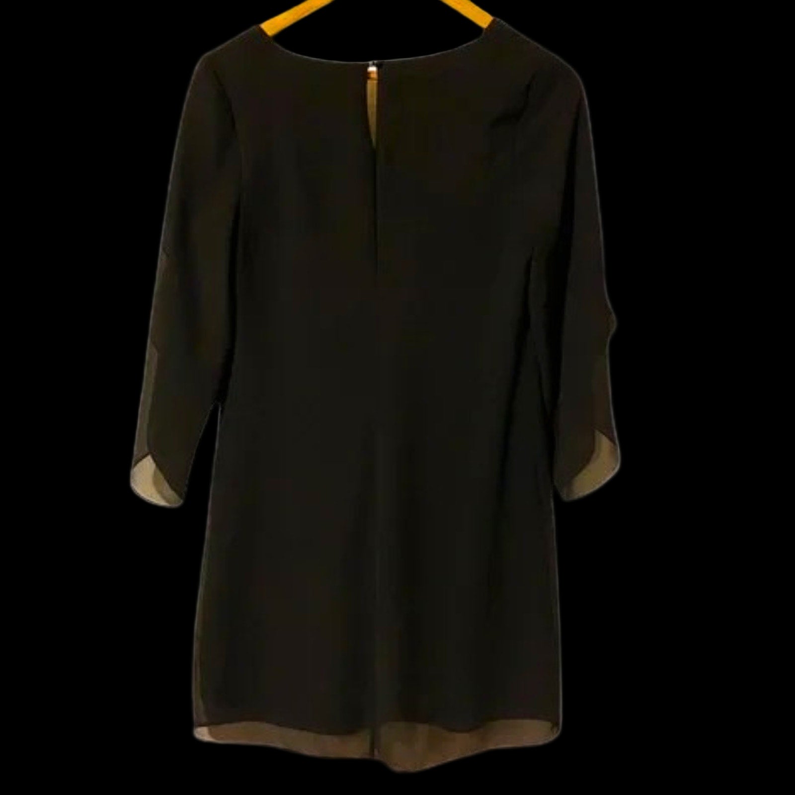 Black dress with sheer sleeves on a white background