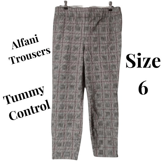 Plaid patterned trousers with text indicating brand and size on a green background