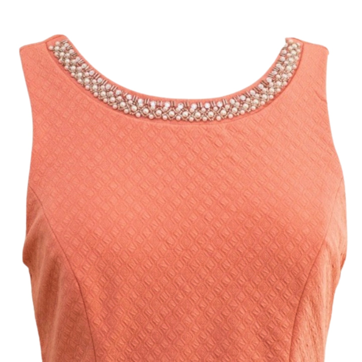 Coral-colored sleeveless top with pearl embellishments on a white background