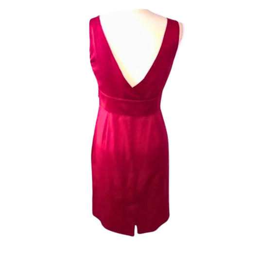 Red dress on a mannequin against a white background