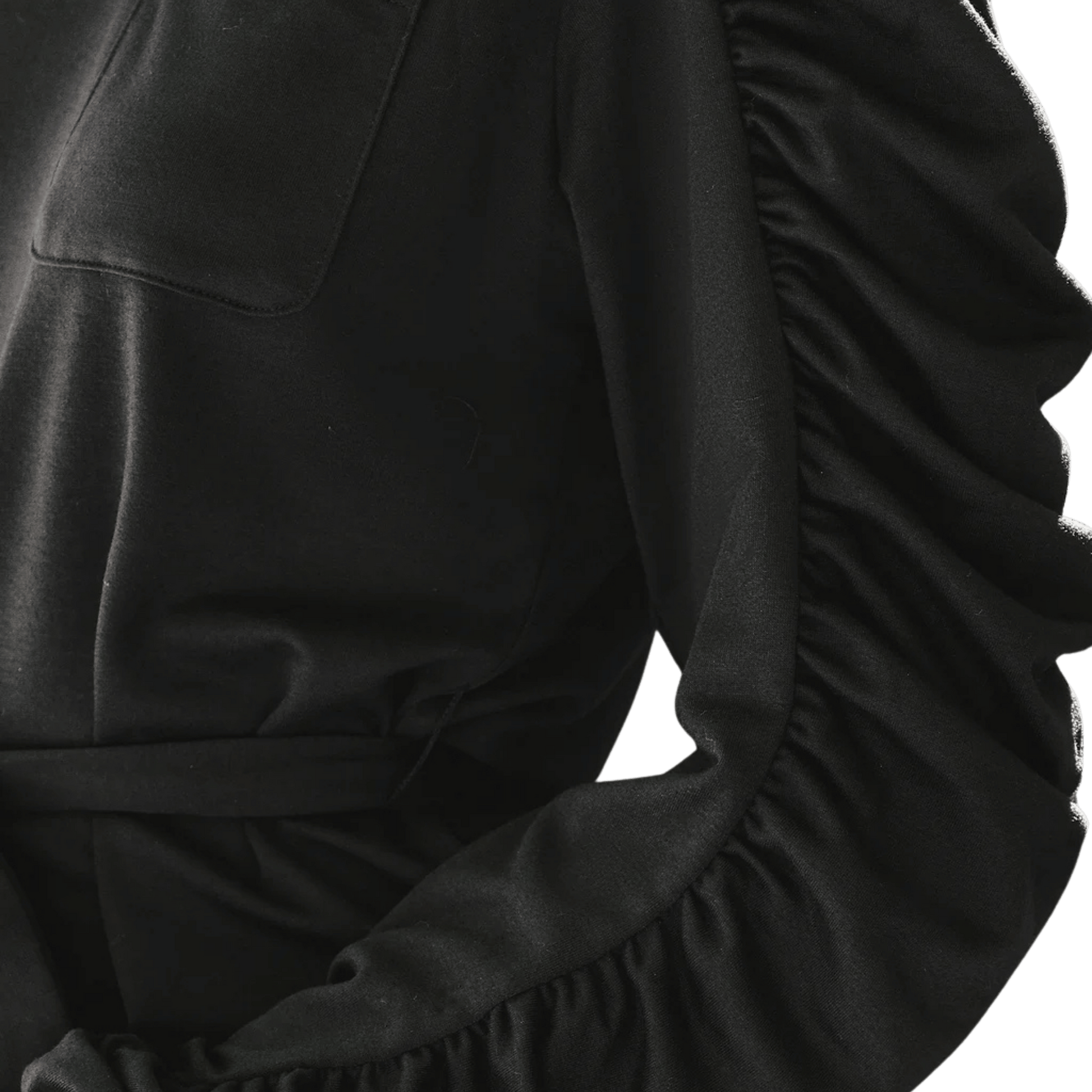 Close-up of a black outfit with ruffled sleeves on a transparent background