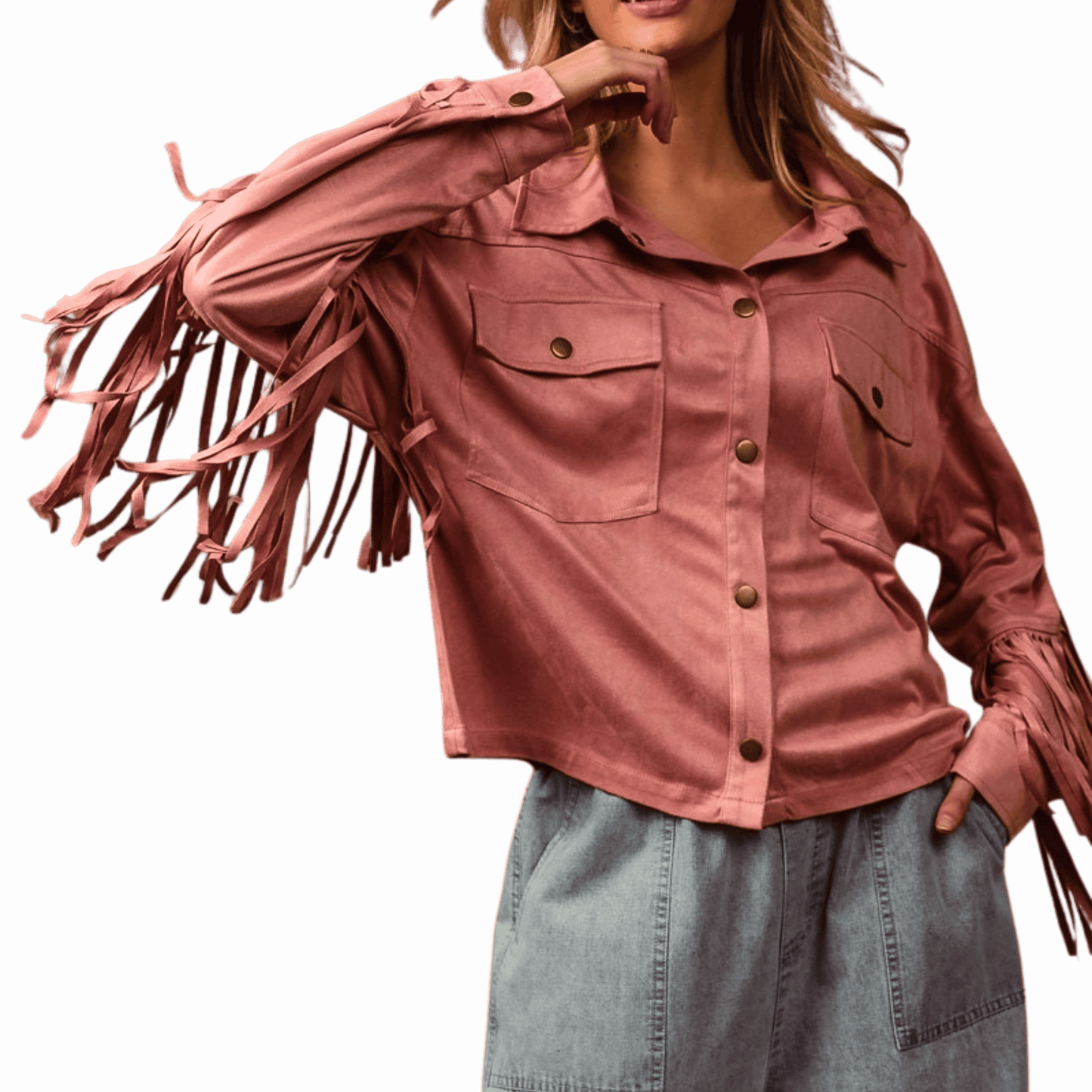 Person wearing a pink fringed jacket with a dark background