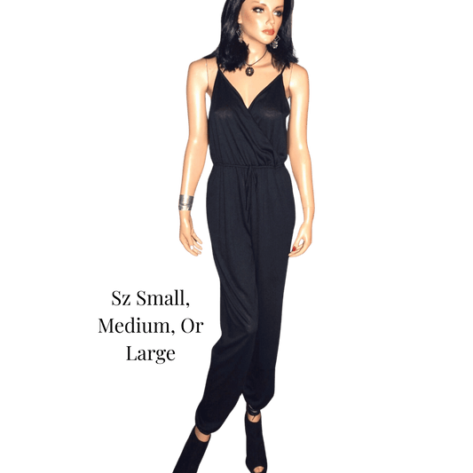 Woman wearing a black jumpsuit on a green background with text indicating size options.