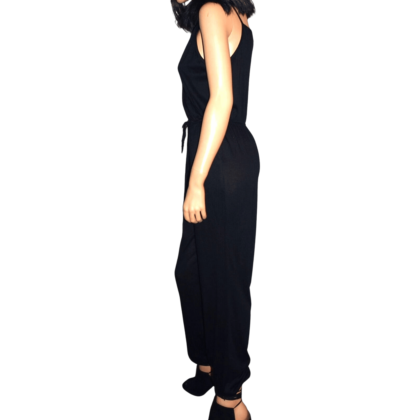 Black jumpsuit worn by a person on a transparent background