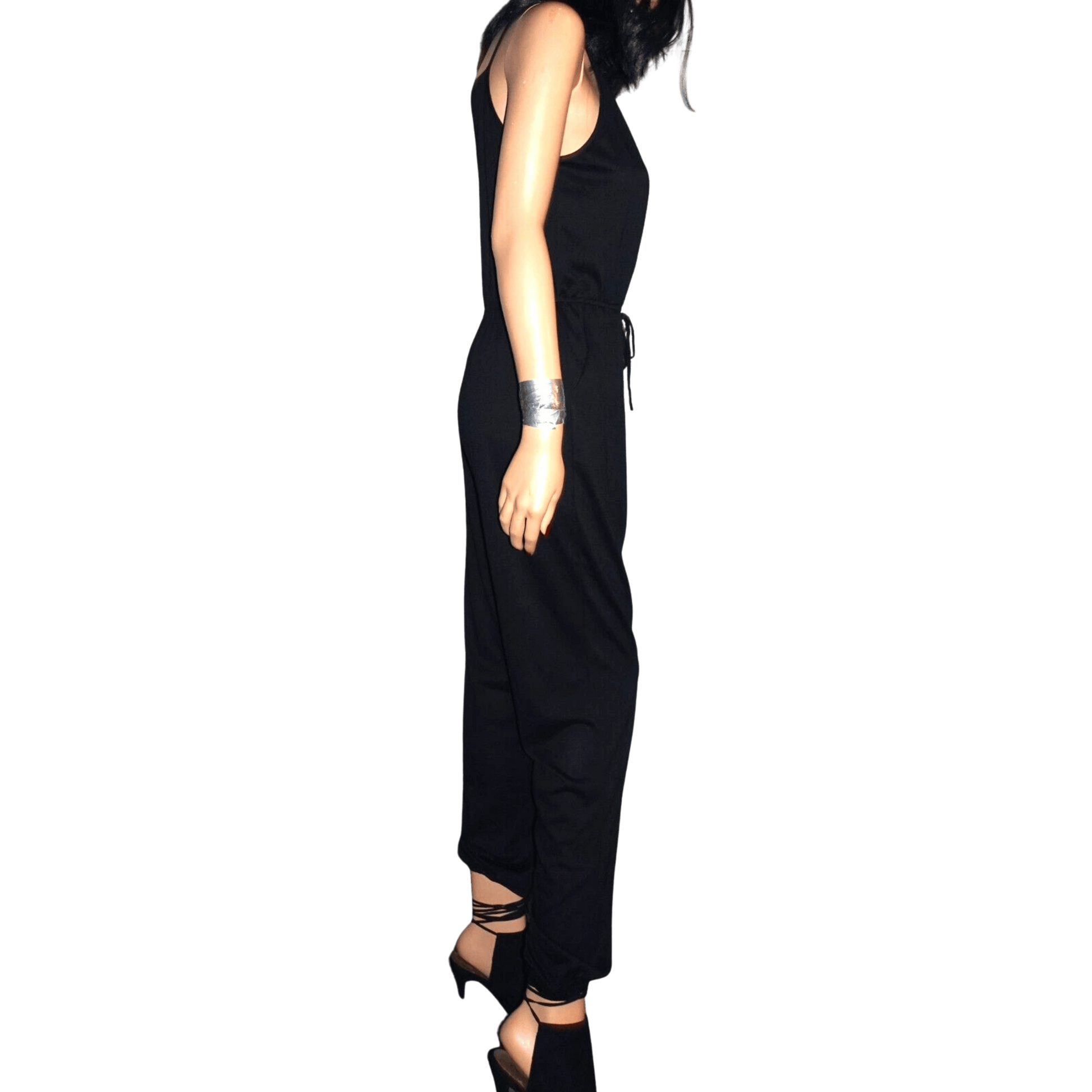Person wearing a black jumpsuit on a transparent background