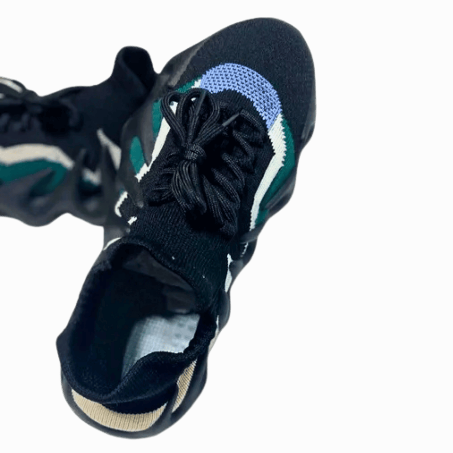 Close-up of a black sock shoe with a gray background