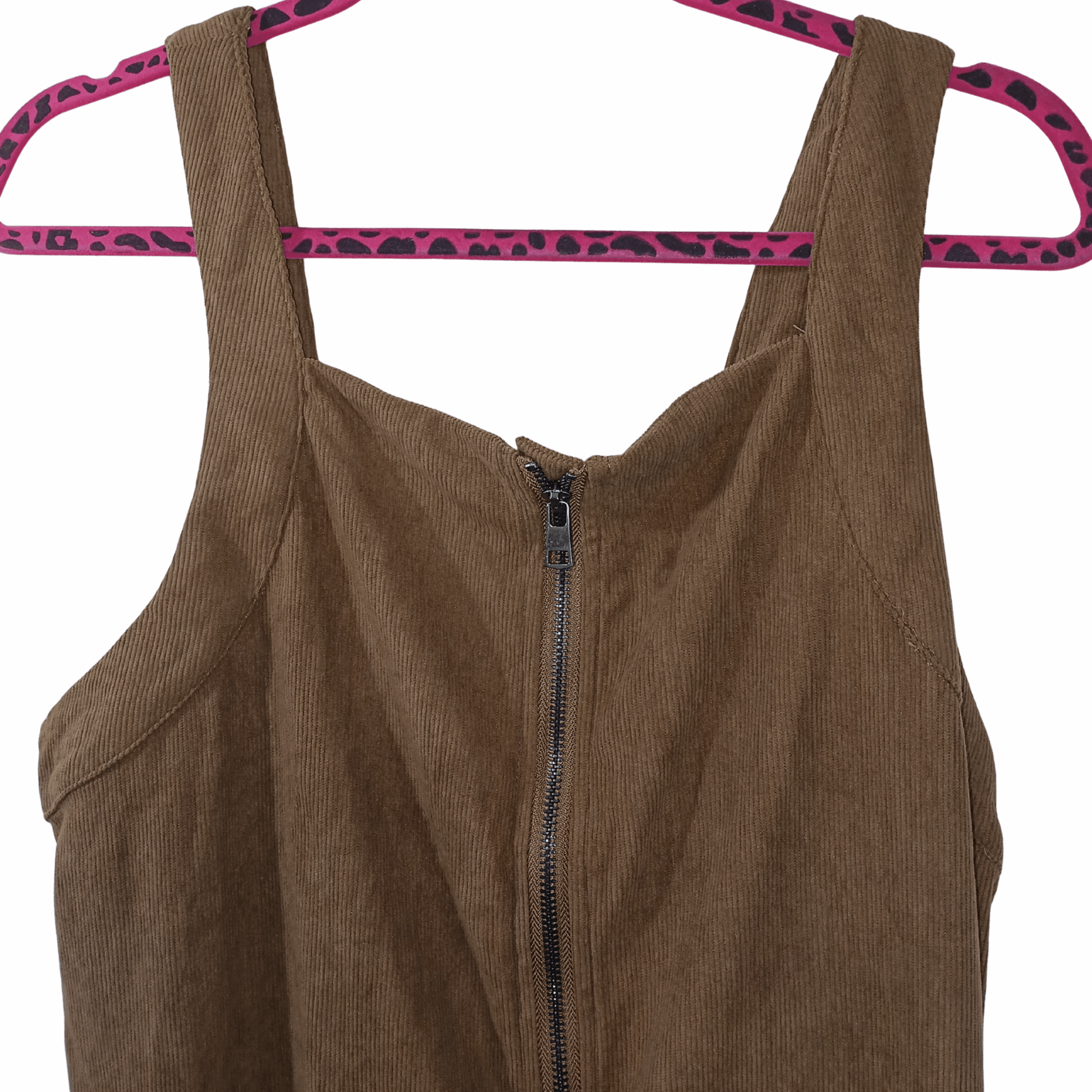 Brown corduroy dress with a zipper on a pink hanger with leopard print pattern against a gray background