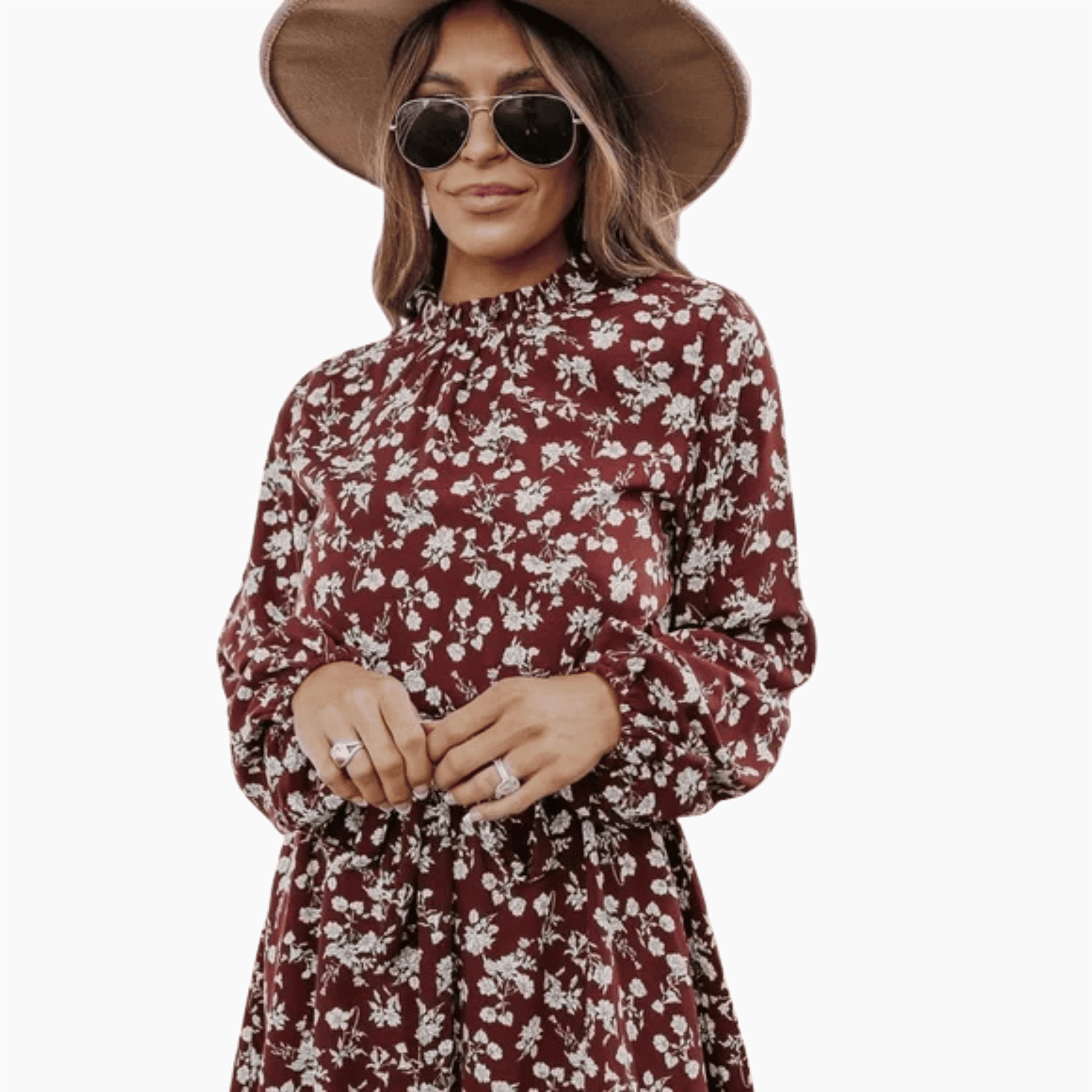 Woman wearing a floral dress and hat on a brown background