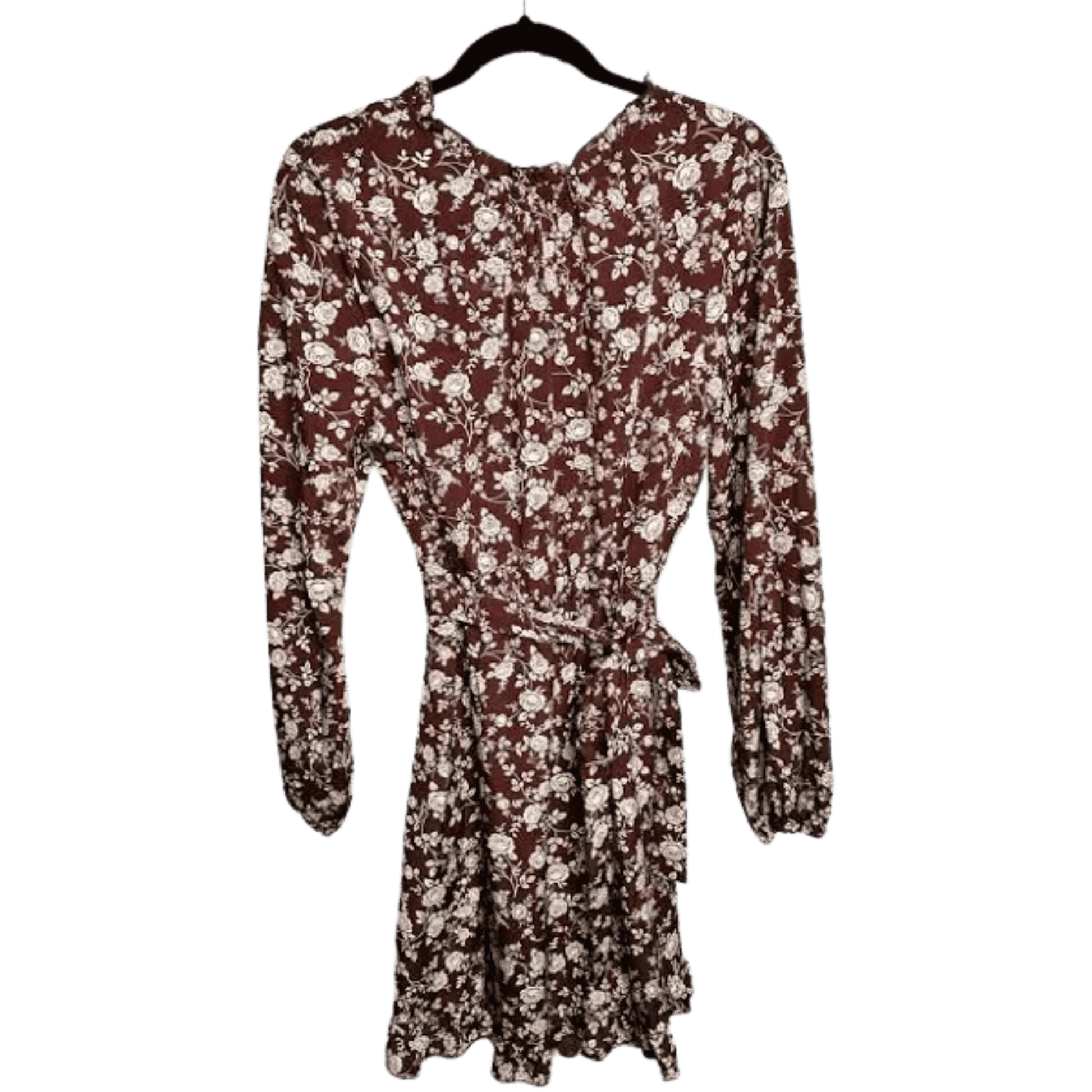 Floral dress with long sleeves on a hanger against a white background