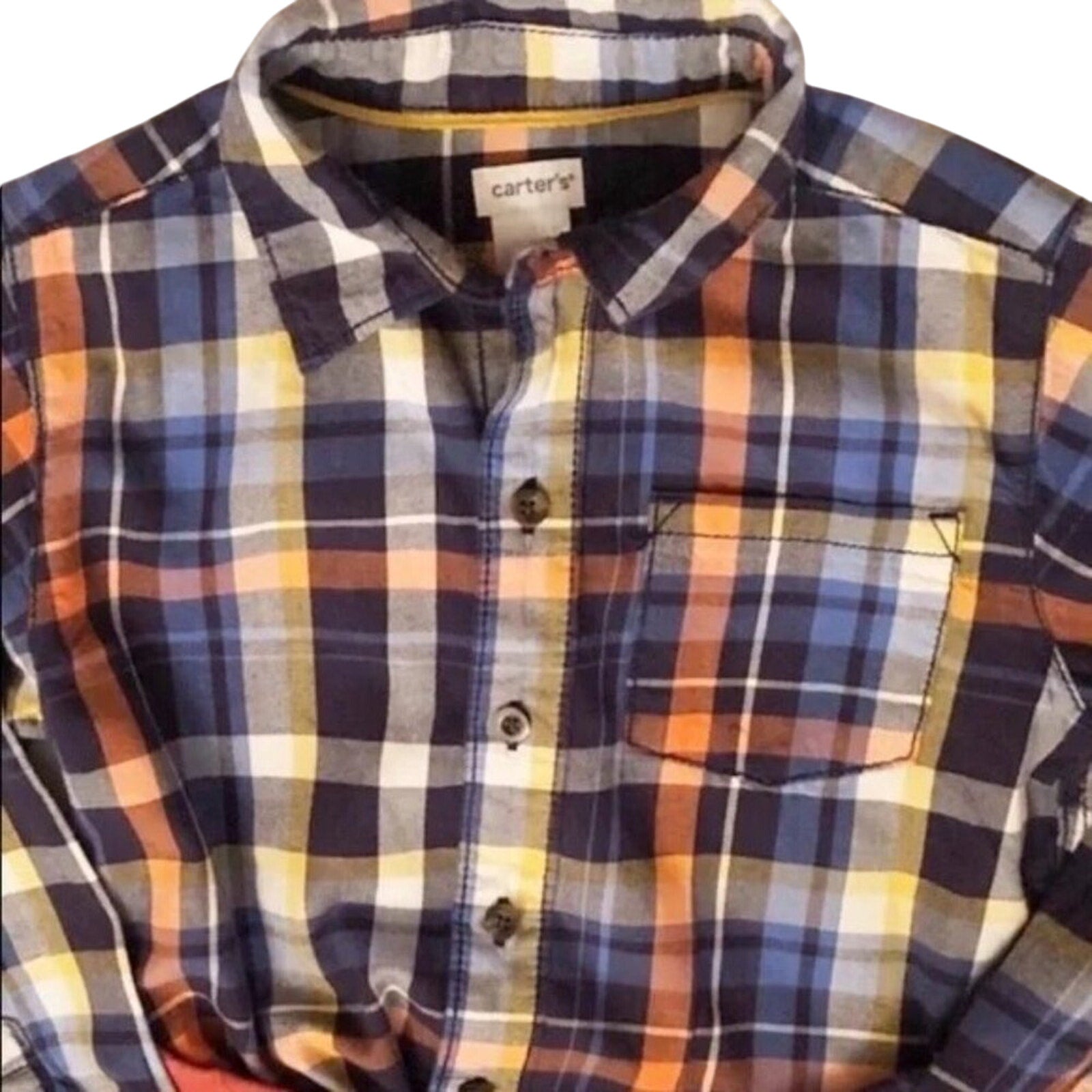 Plaid shirt with visible Carter's label on a white background
