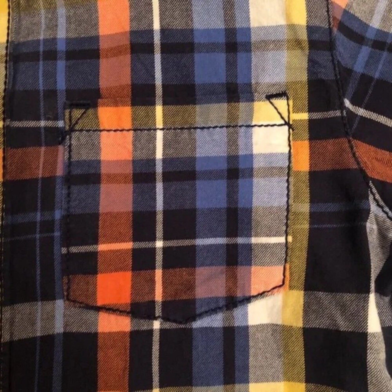 Close-up of a plaid shirt with a pocket