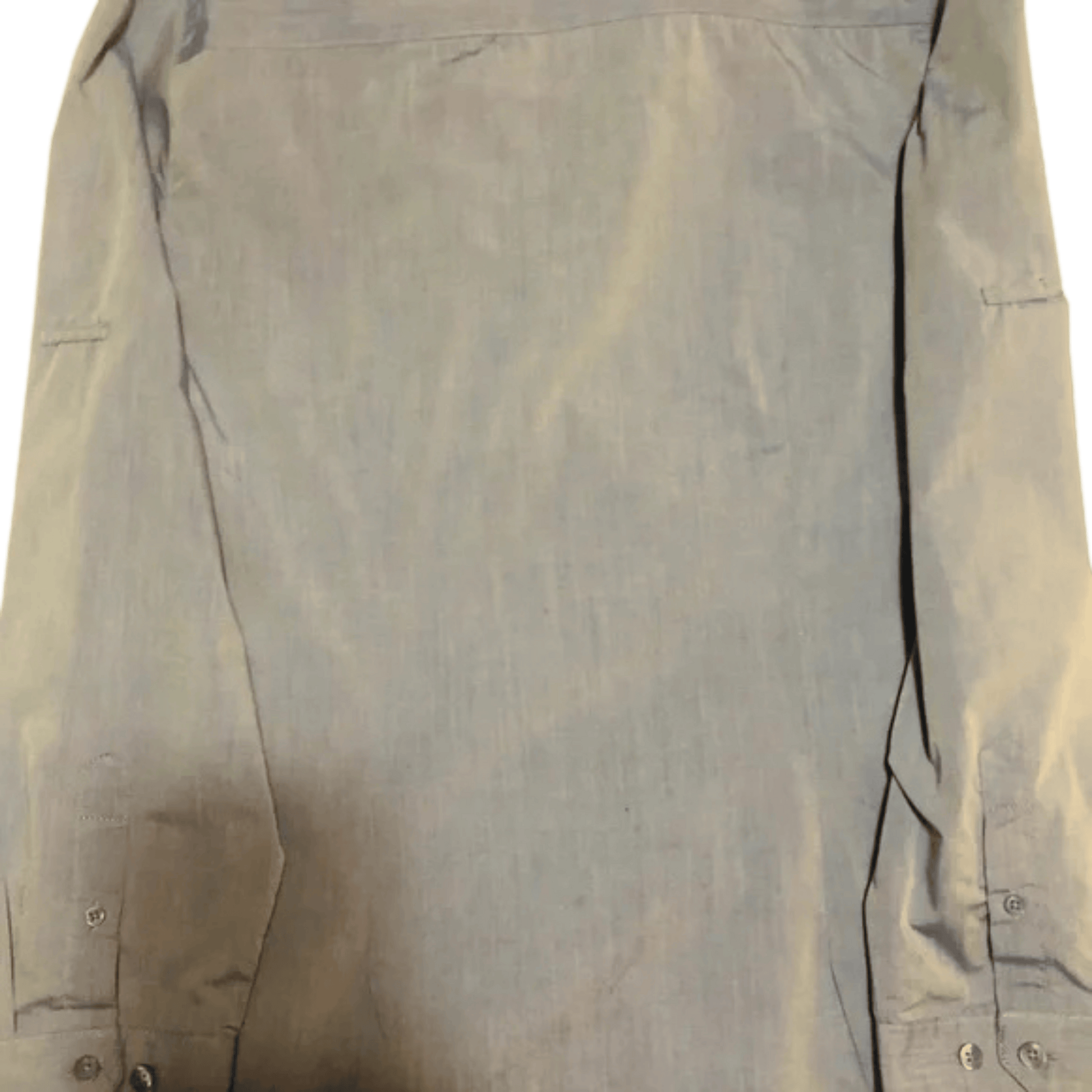 Light brown shirt on a green background