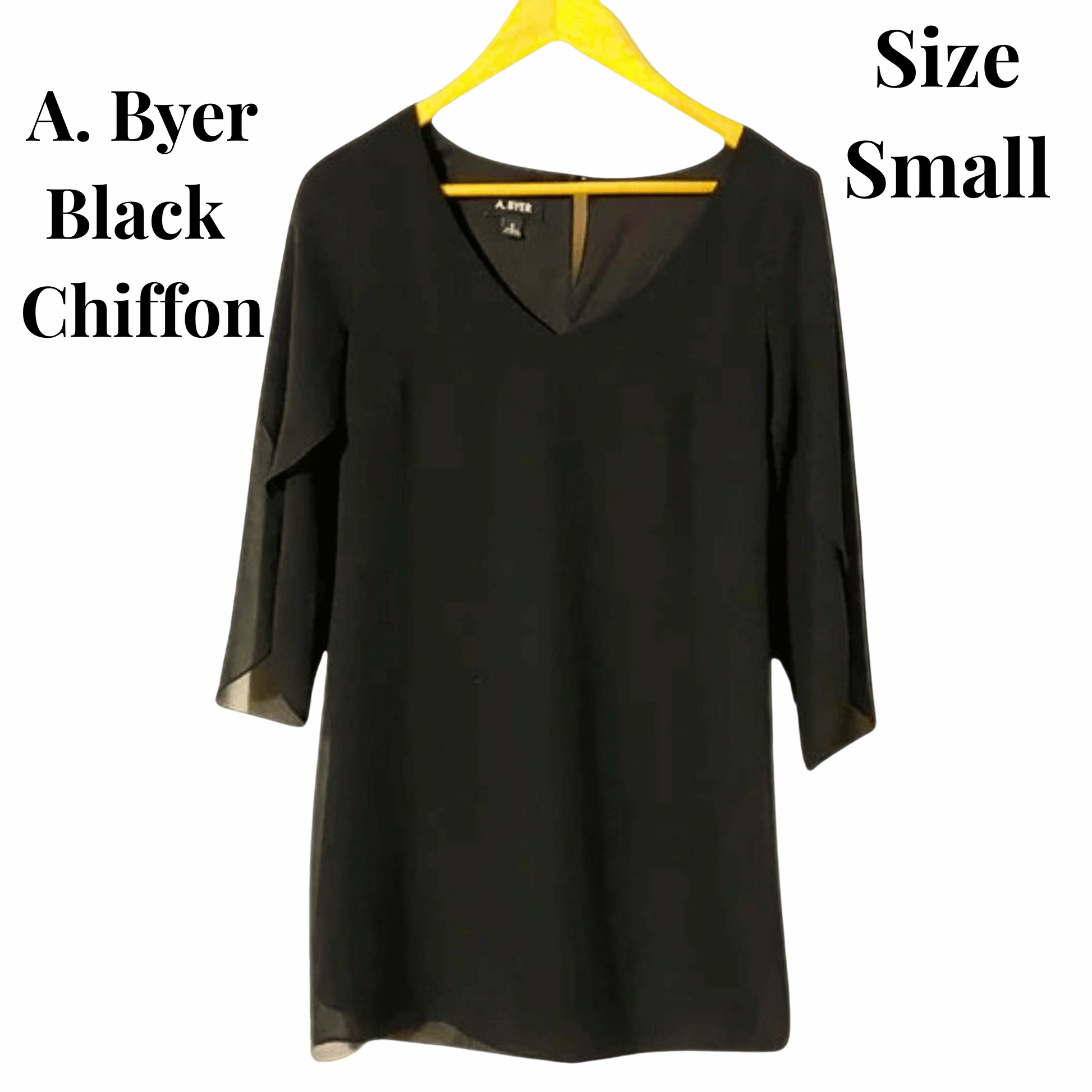 Black chiffon blouse on a yellow hanger with text indicating brand and size.