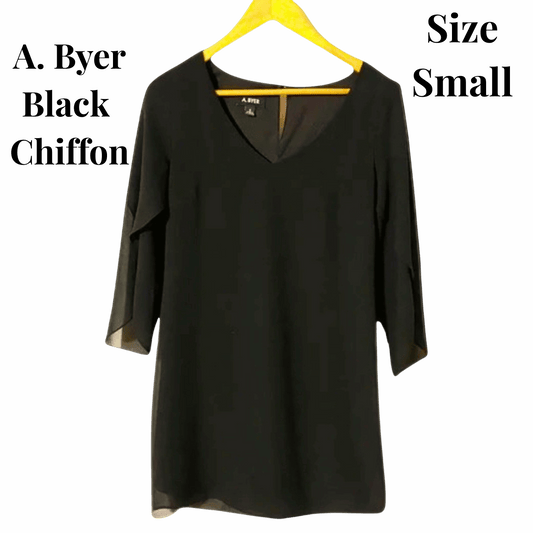 Black chiffon blouse on a yellow hanger with text indicating brand and size.