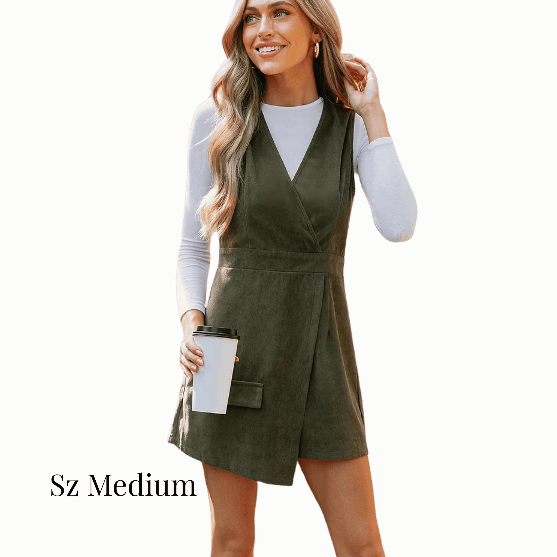 Woman wearing a green dress holding a coffee cup on a solid background