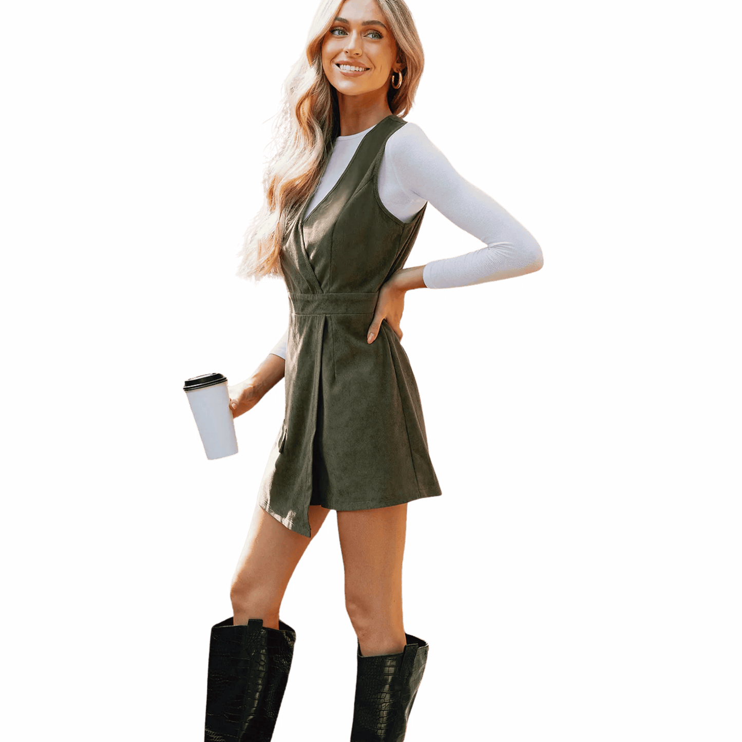 Woman in a green dress holding a coffee cup against a blue background