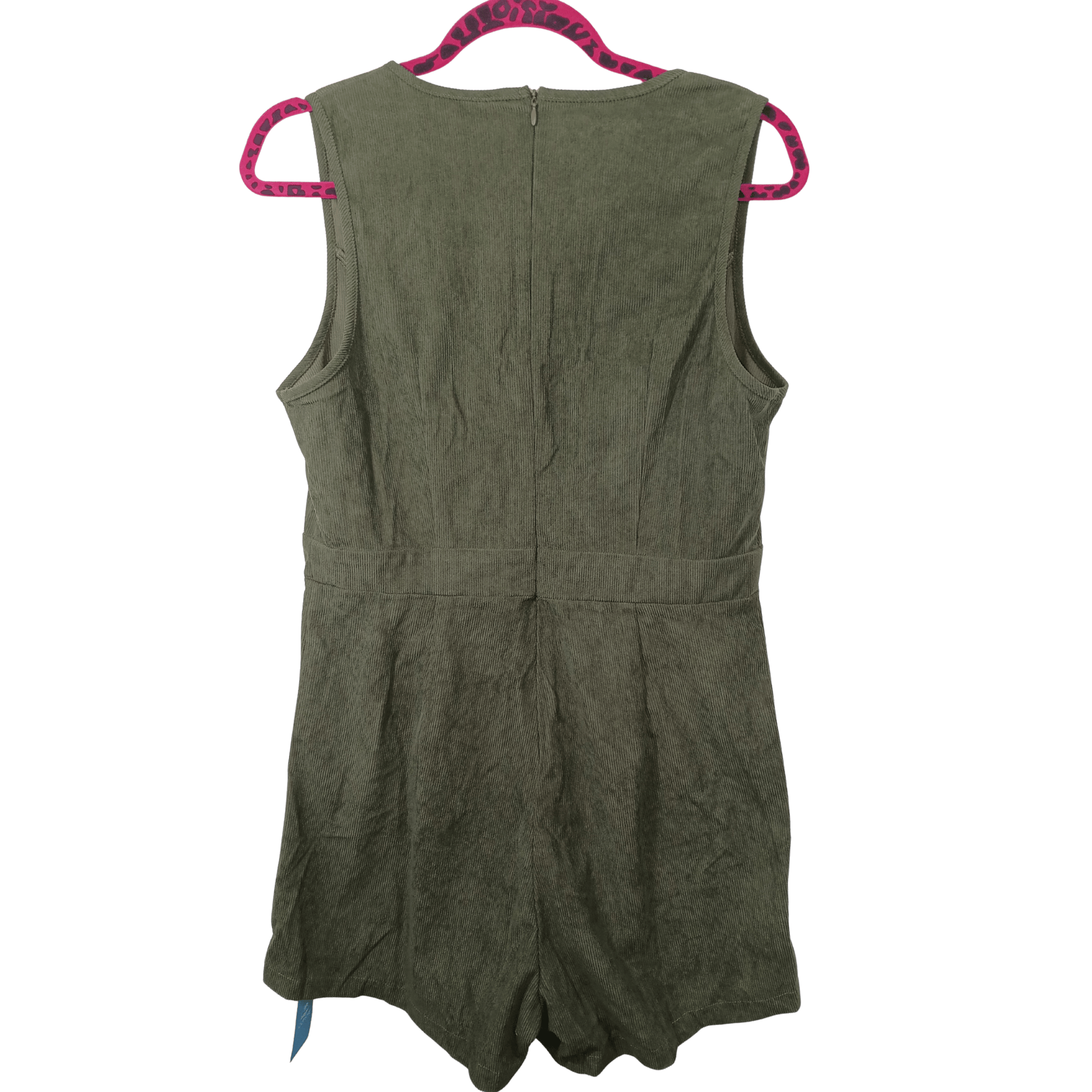 Green romper on a hanger with pink trim against a white background