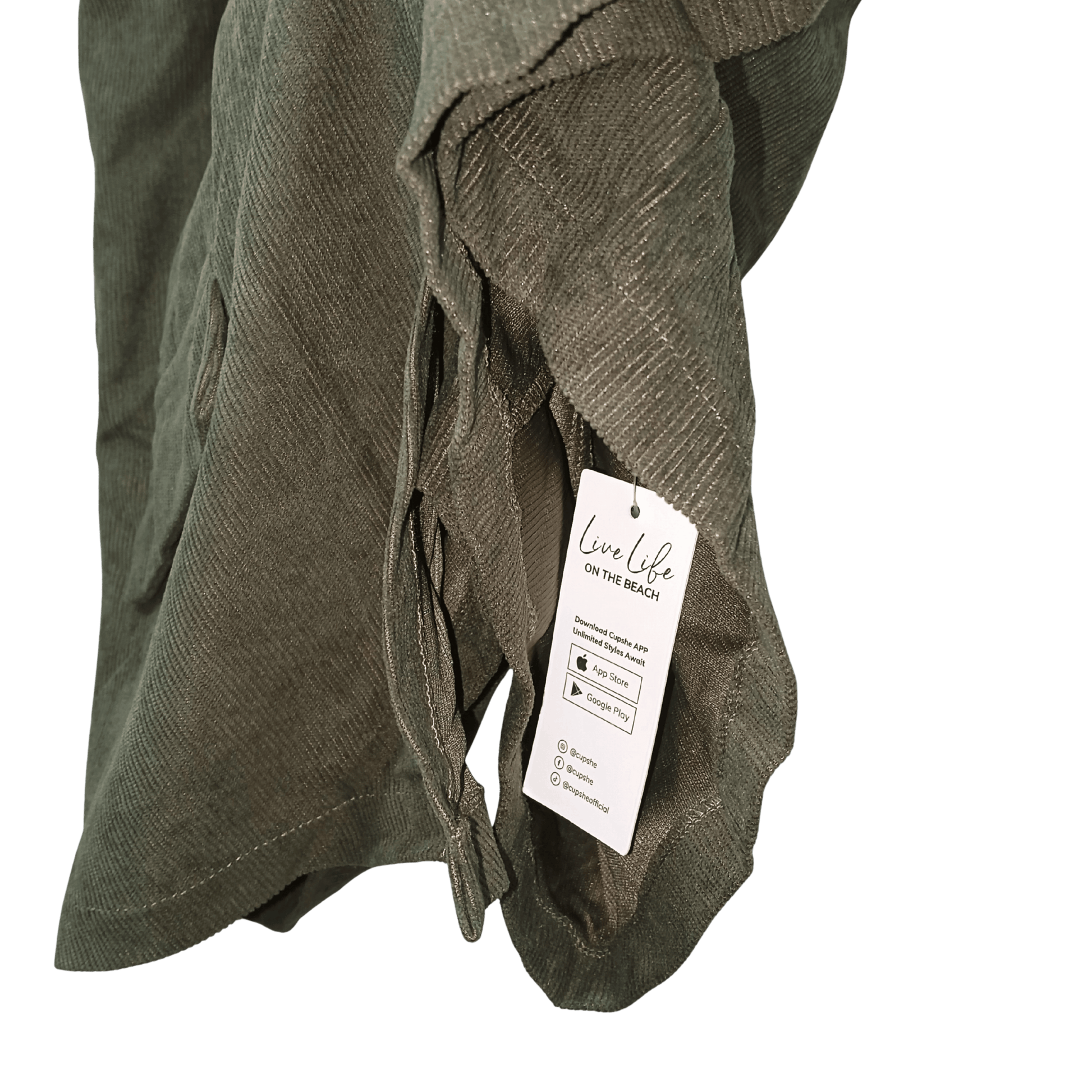 Green textured fabric with a tag on a transparent background