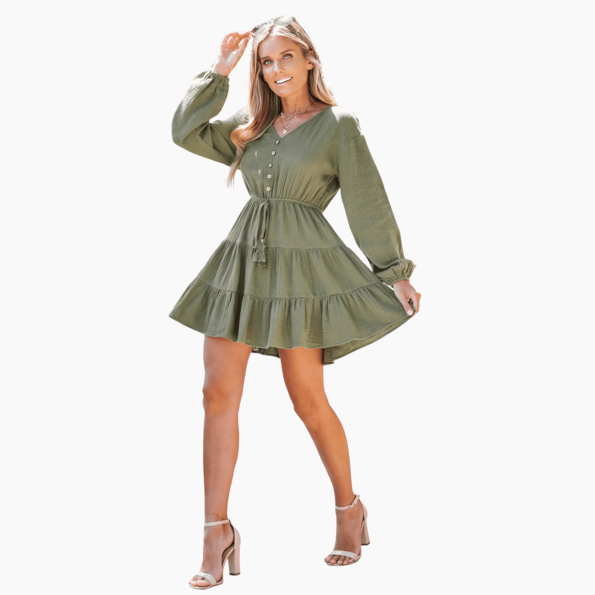 Woman wearing a green dress on a dark background