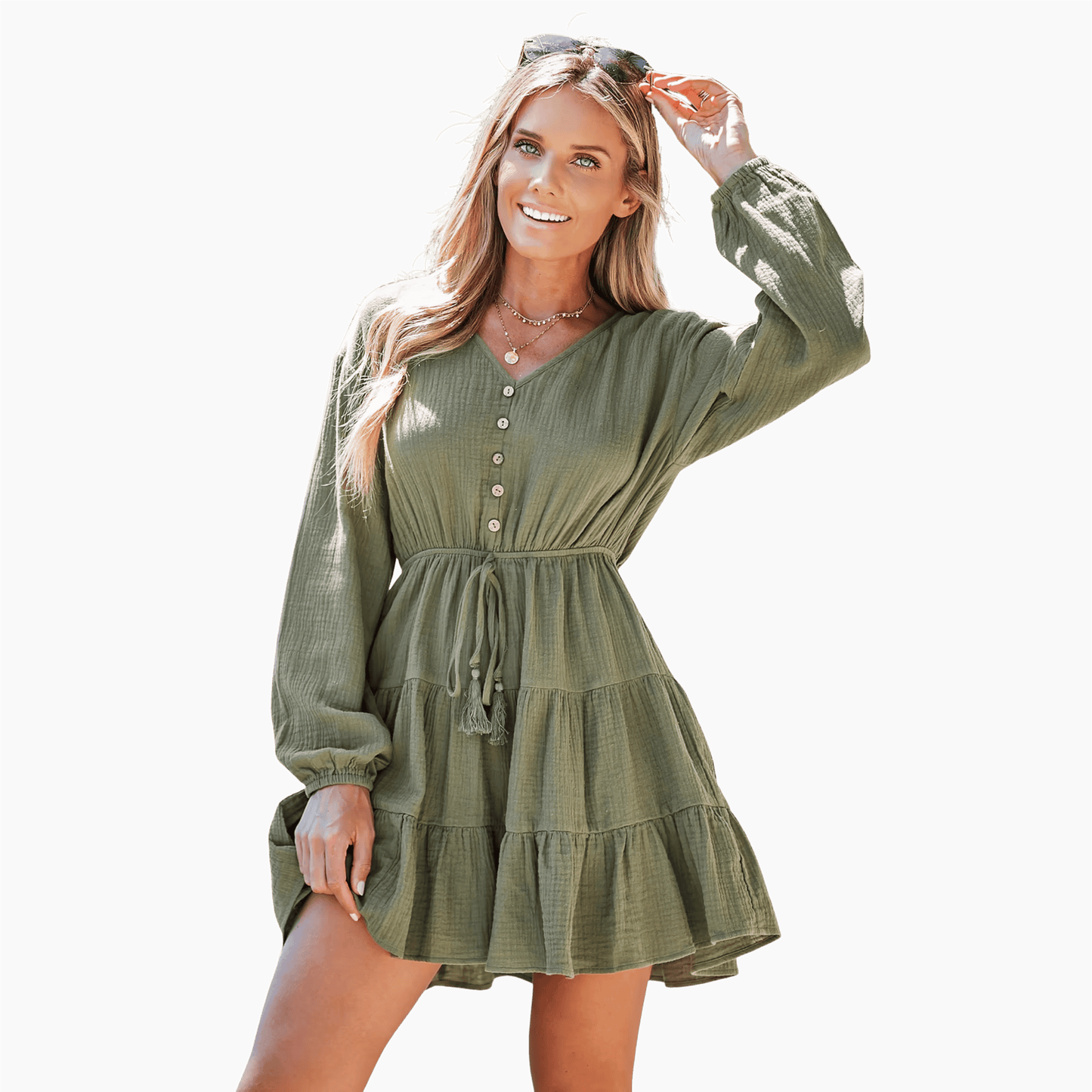 Woman wearing a green dress against a brown background