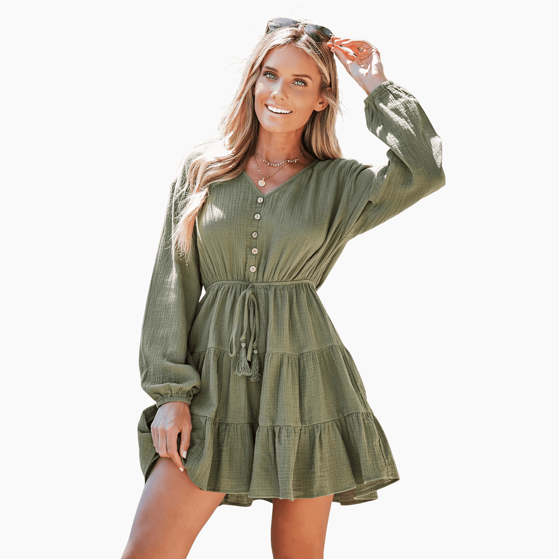 Woman wearing a green dress against a brown background