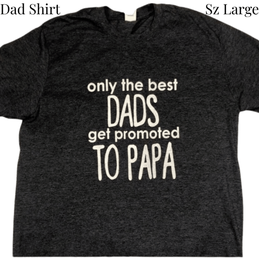 Black t-shirt with white text 'only the best DADS get promoted TO PAPA' on a transparent background